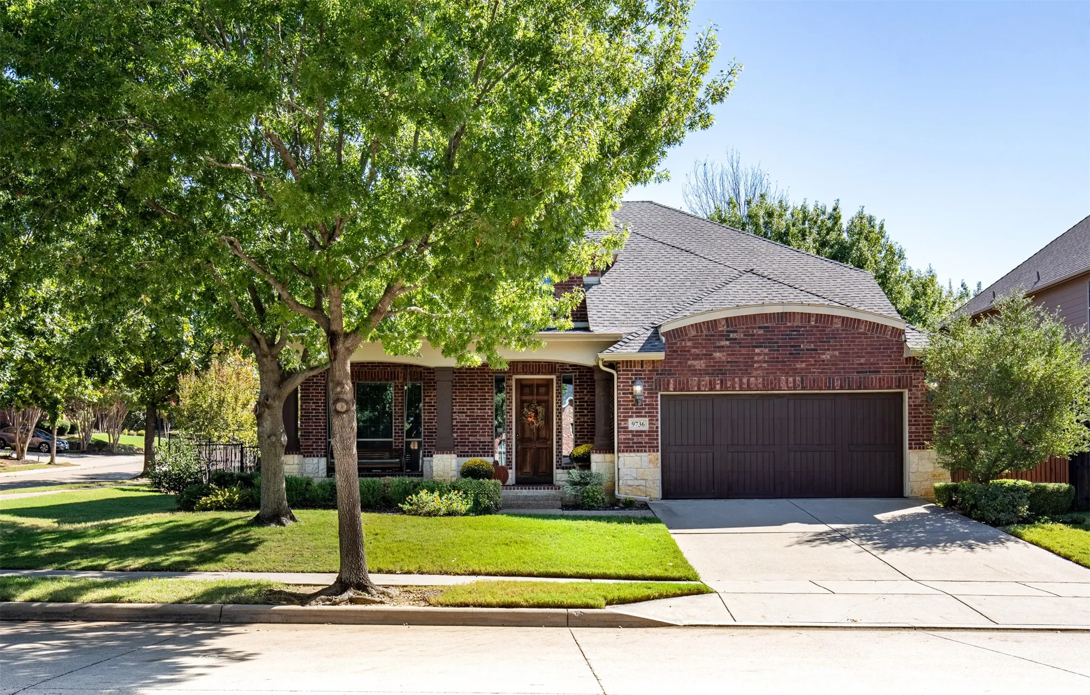 Exterior features large shade trees, front entry garage, and cozy front porch that welcomes you inside.