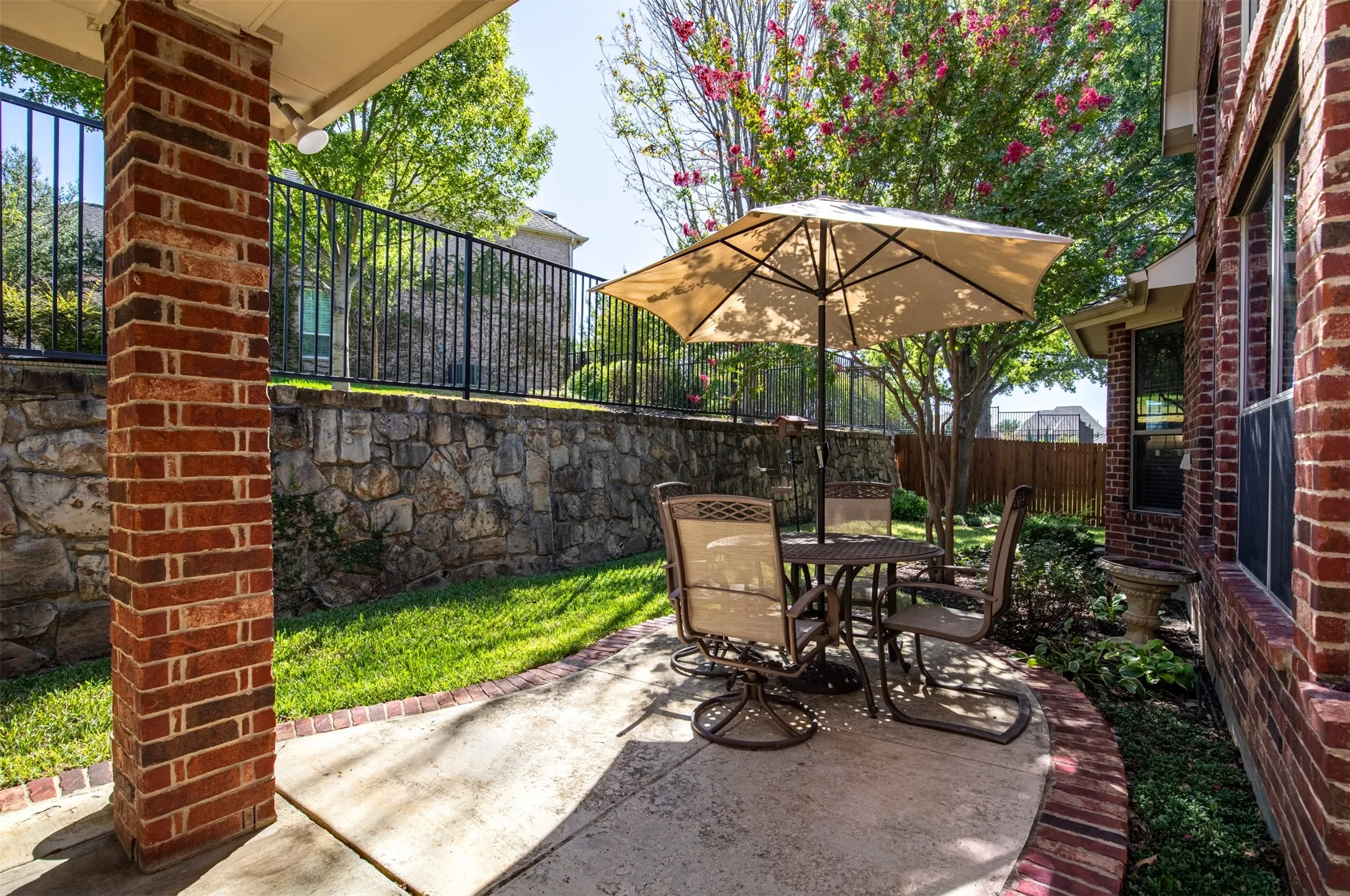 Extended patio with brick border.