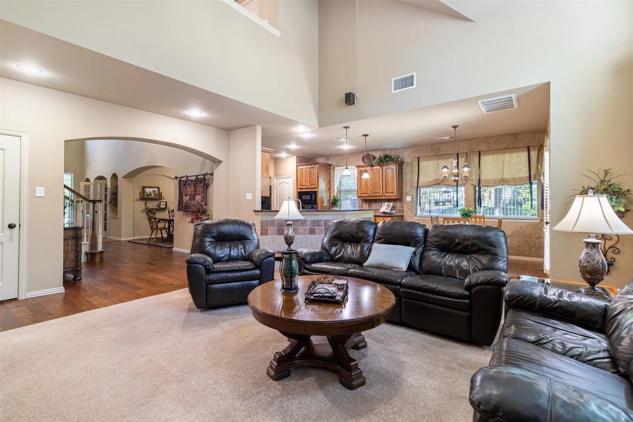 Open-concept living room to breakfast room and kitchen.