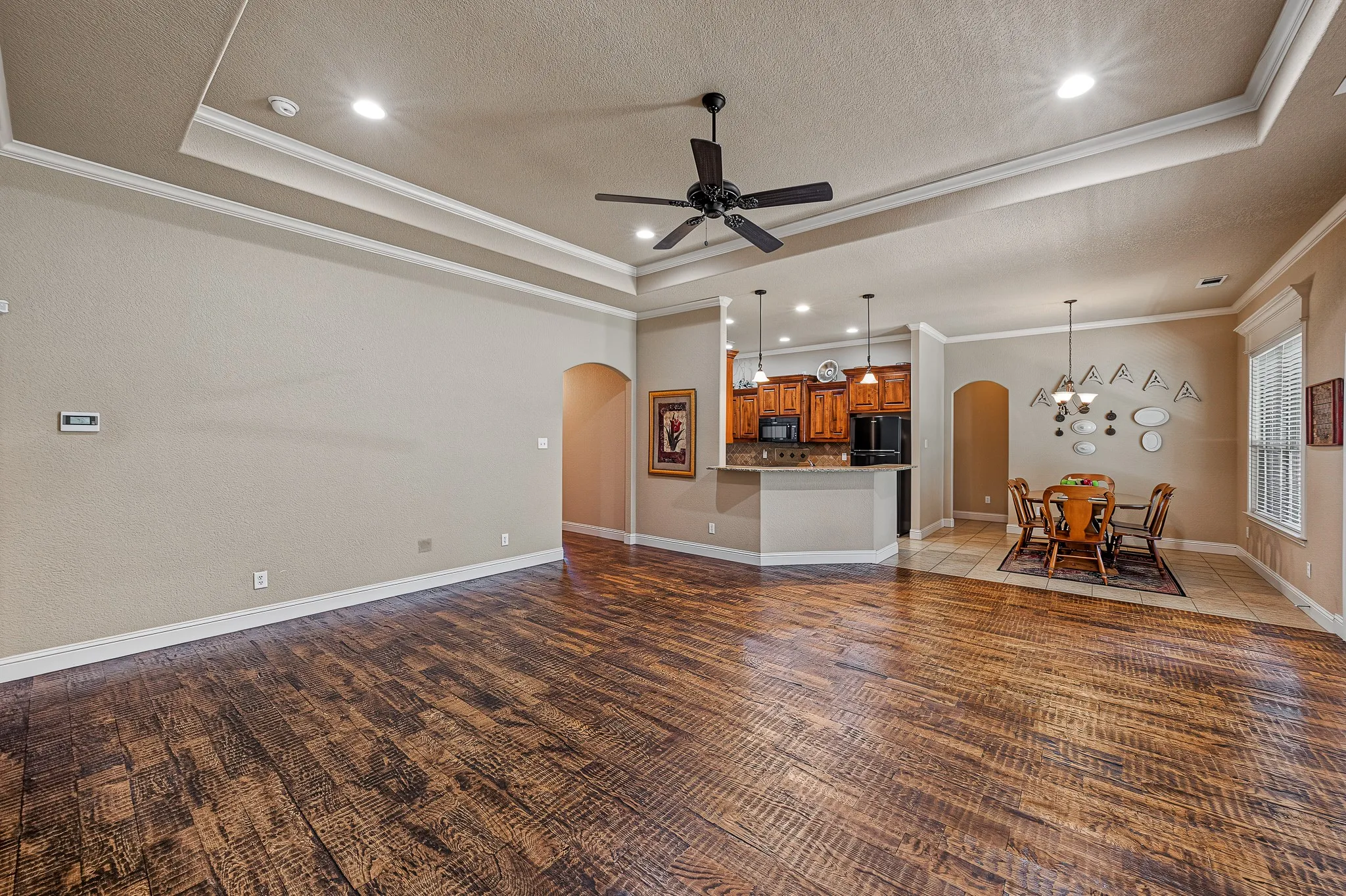 Large living area with beautiful hardwood flooring