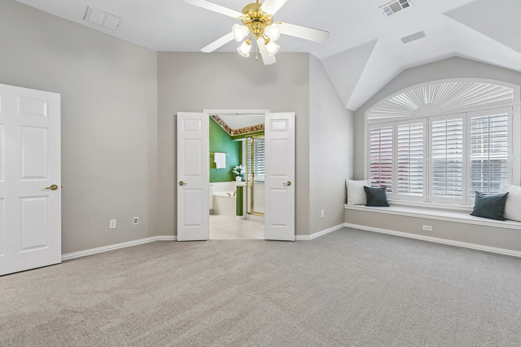 Primary bedroom with built in bench