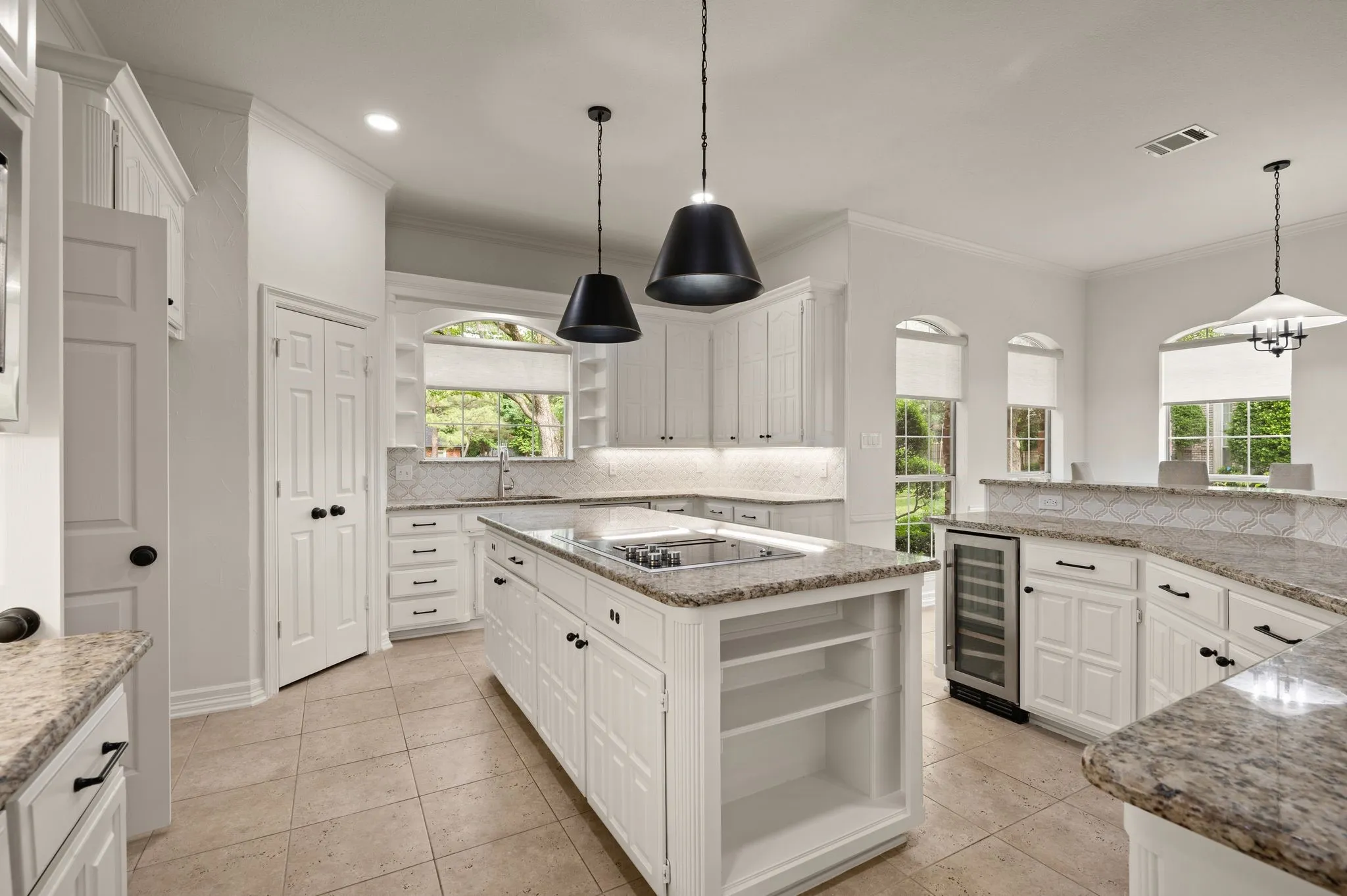 Kitchen featuring open shelves, backsplash, beverage cooler, and black electric cooktop