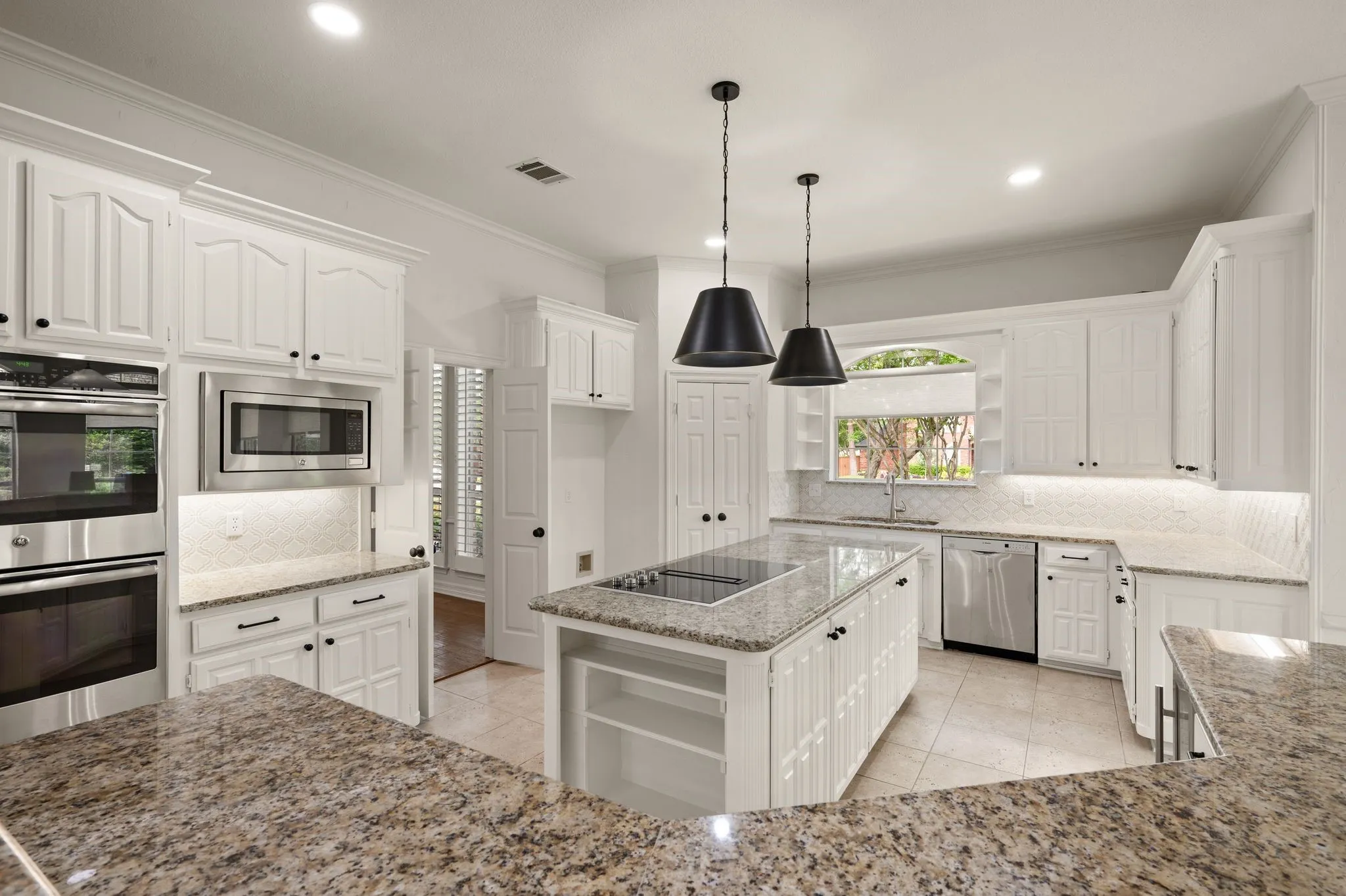 Kitchen with visible vents, open shelves, light tile patterned floors, and stainless steel appliances