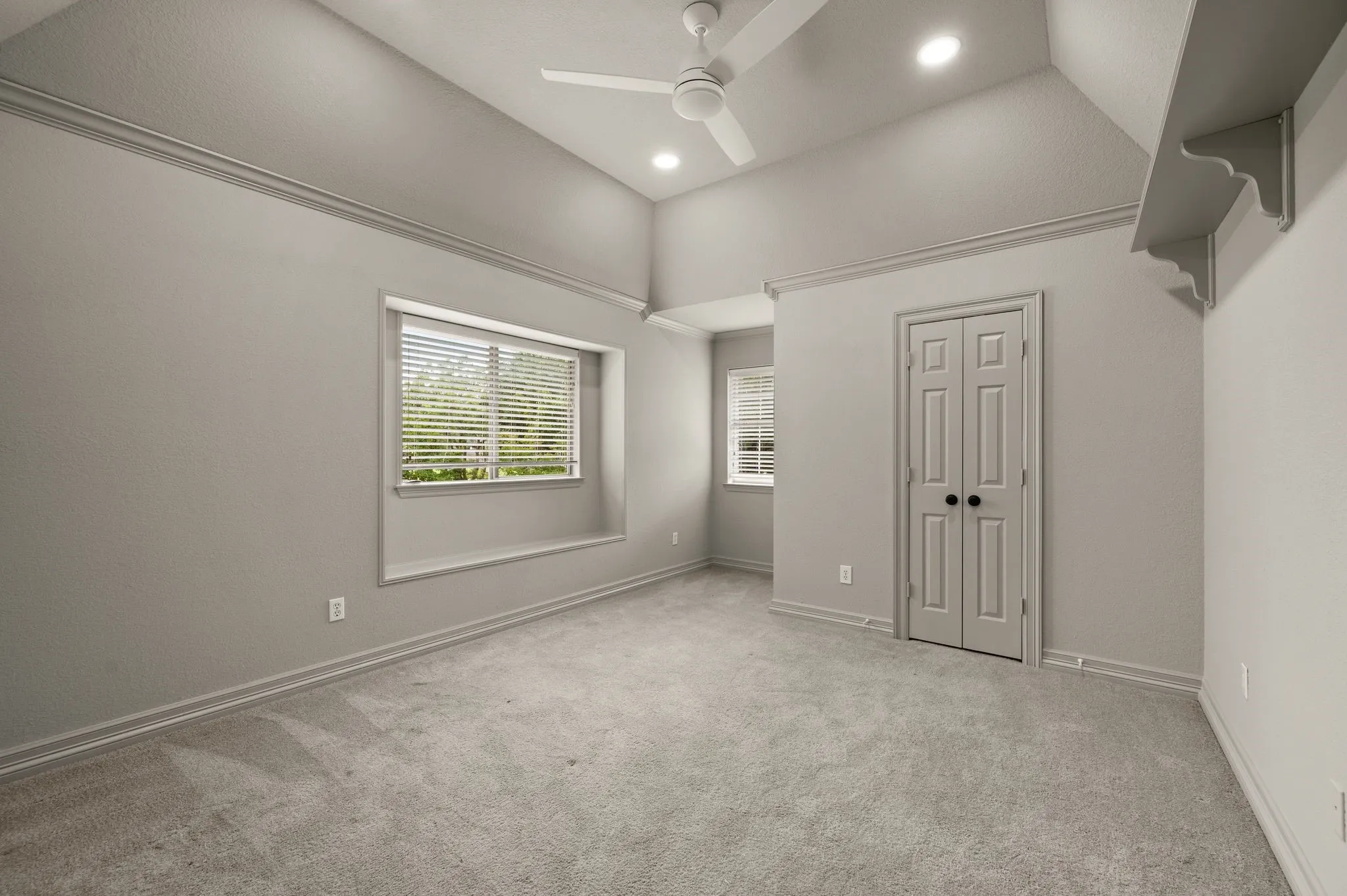 Unfurnished bedroom with recessed lighting, carpet floors, a ceiling fan, and high vaulted ceiling