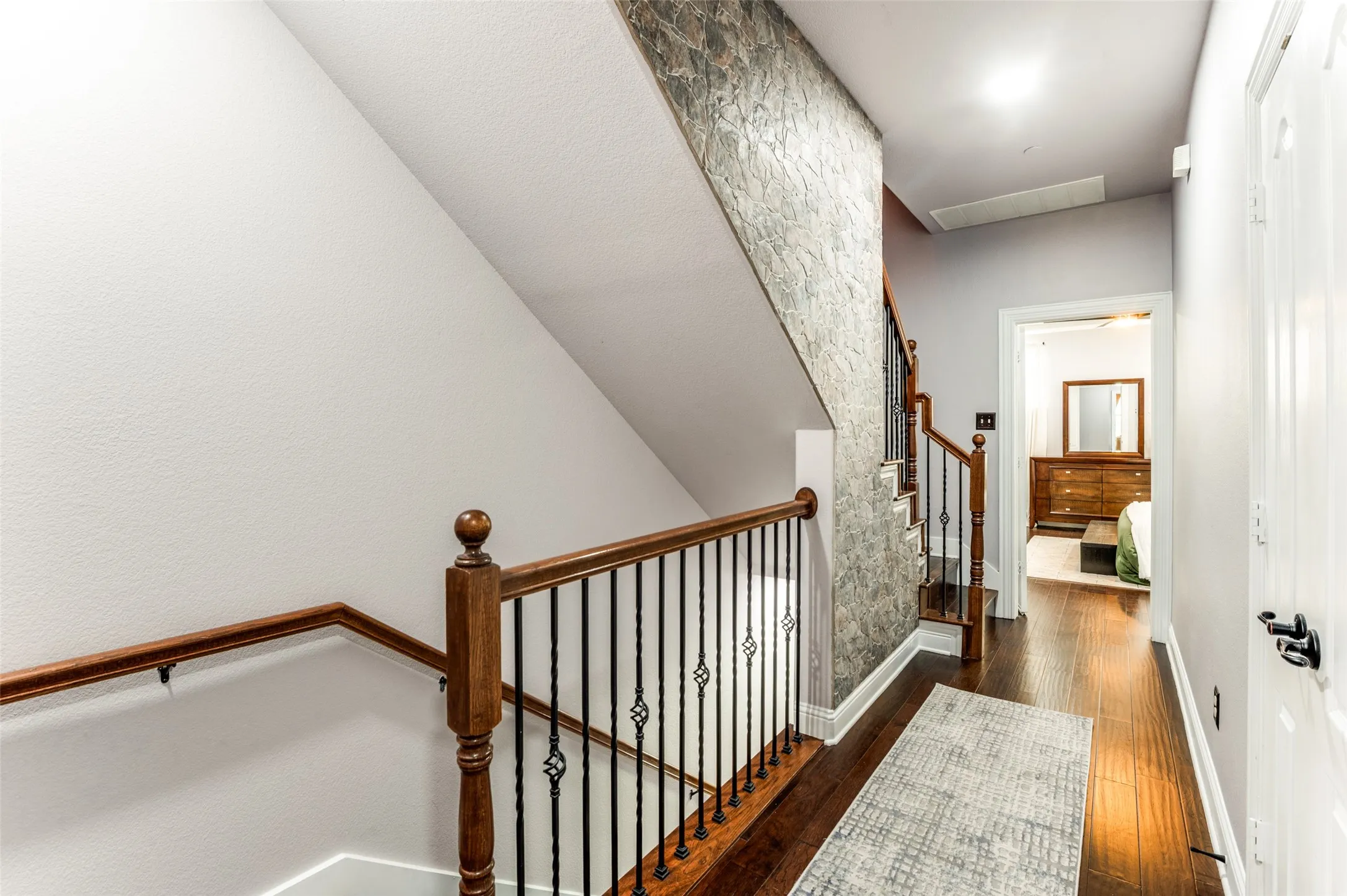 Staircase with Stone Accent Wall