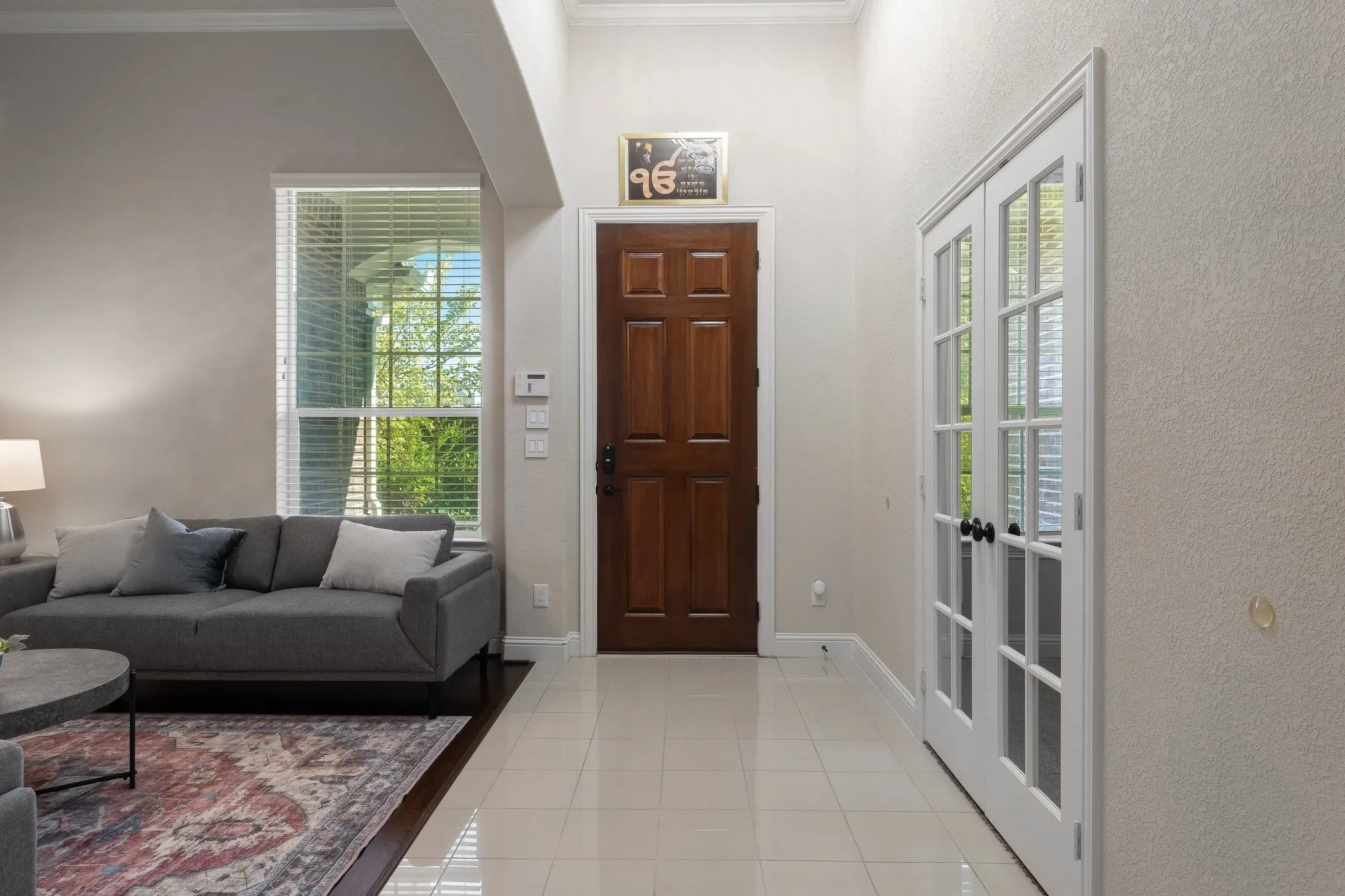Entry at front door formal living and office with French doors