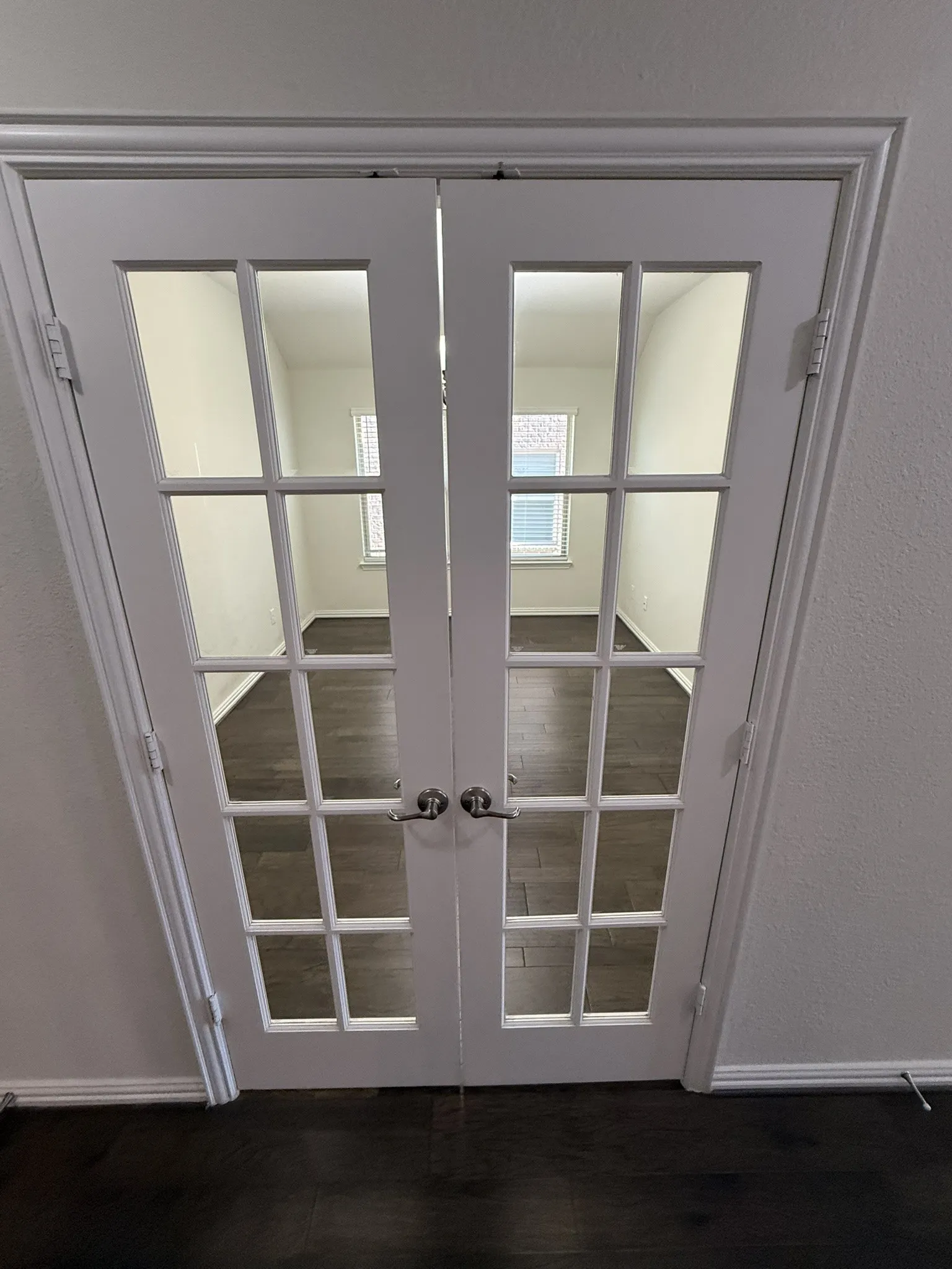 French doors on formal dining/office/flex space