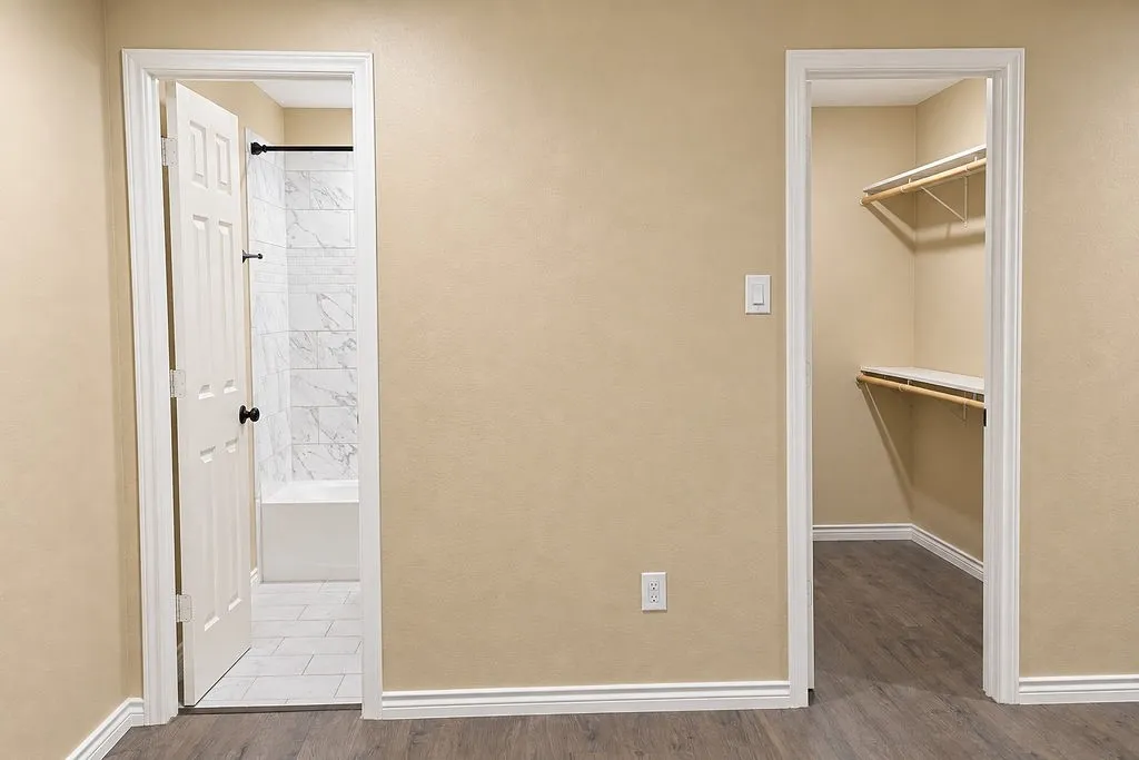 Owners suite with large walk in closet and bathroom.