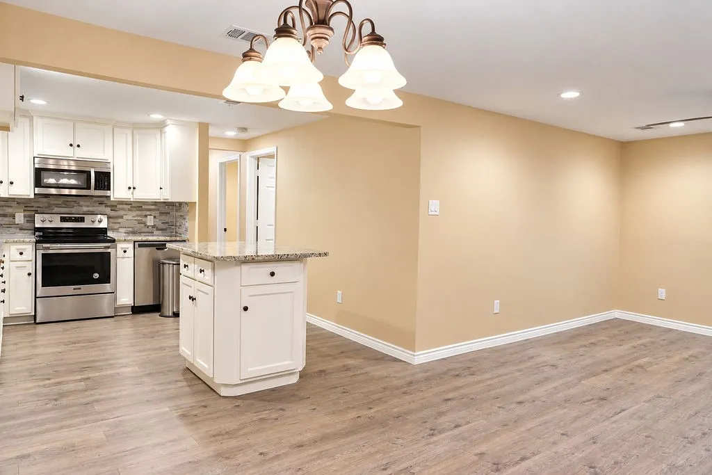 Dinning area with open concept to the Kitchen with island and living room.