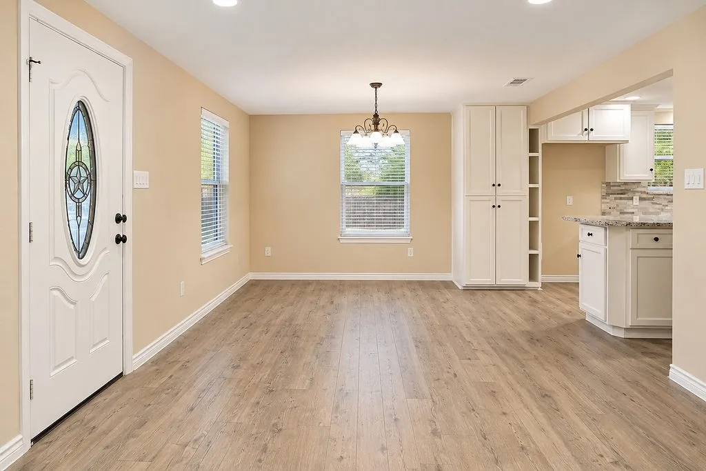 Living room area with open concept to the dinning area.