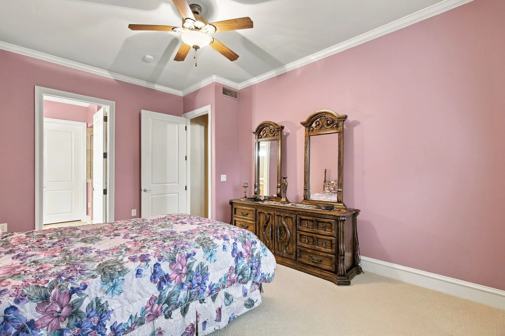 Recessed lighting with a ceiling fan fixture, crown molding, and white trim accents