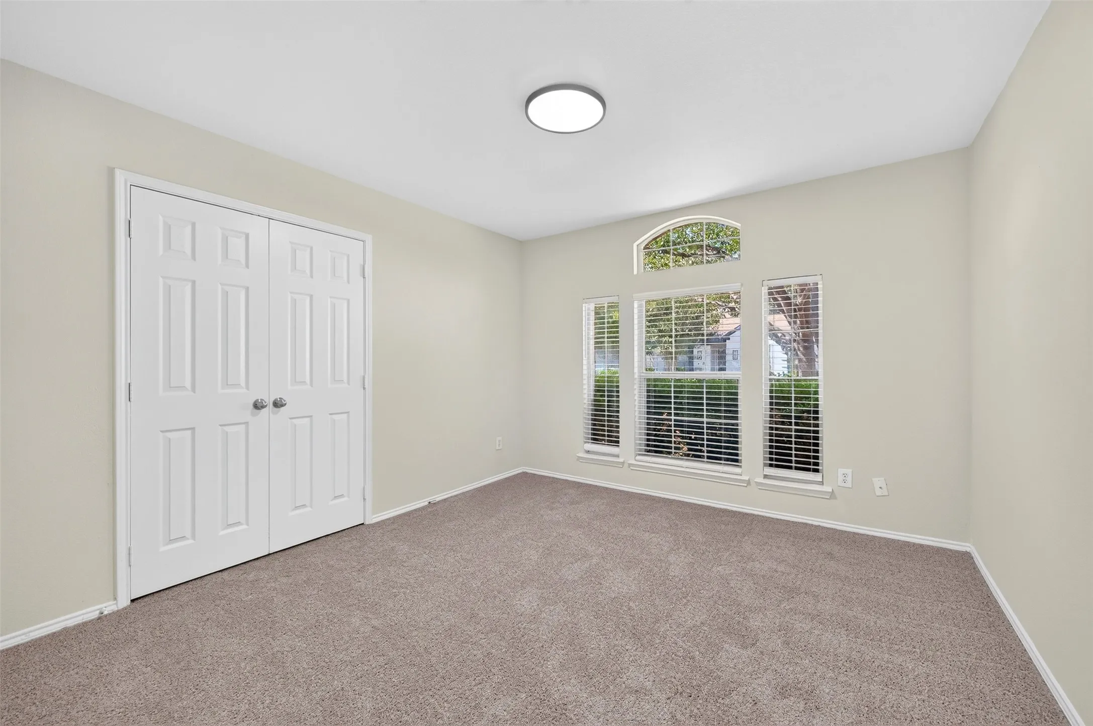Neutral tone walls with carpet flooring