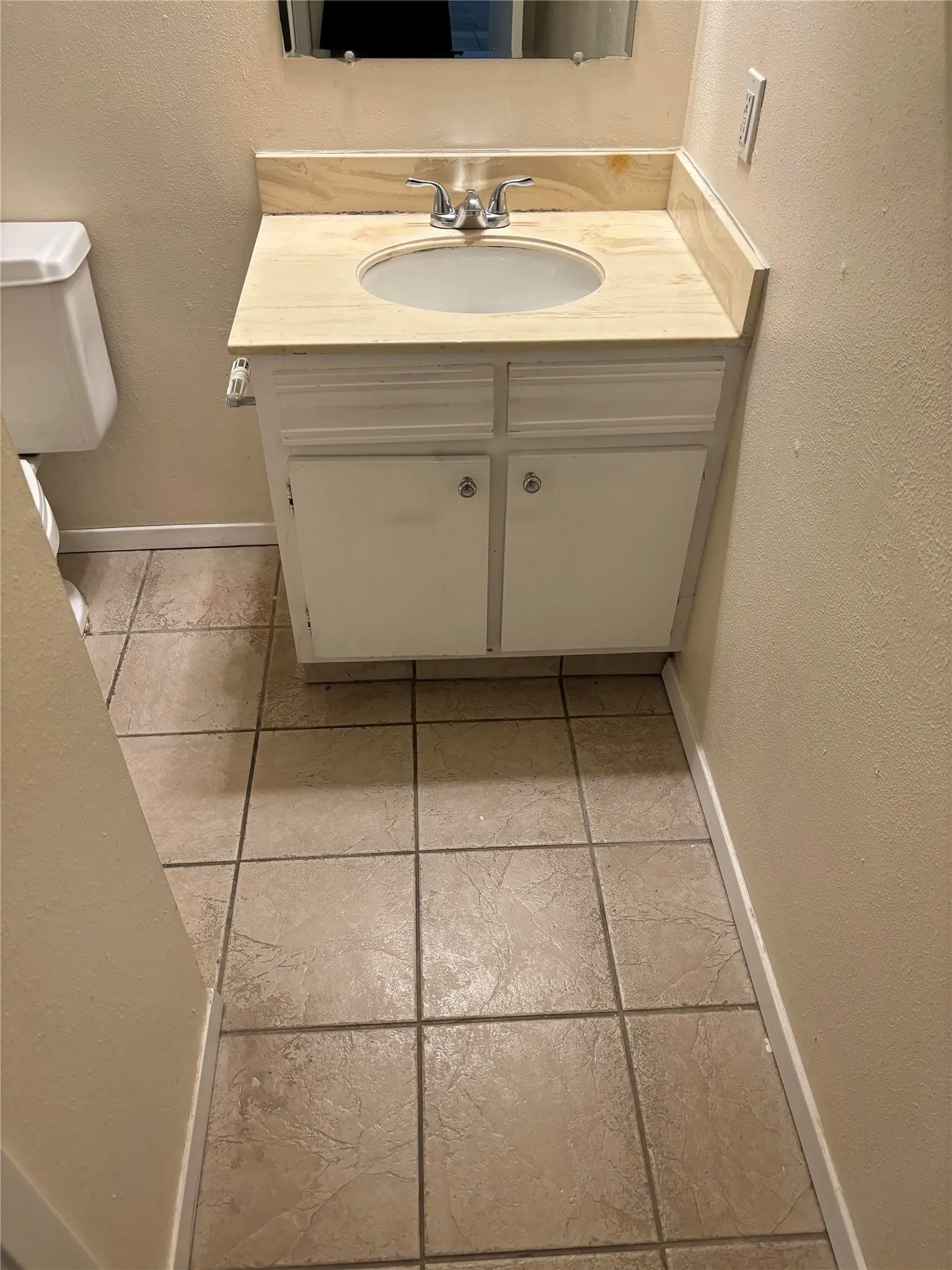 Bathroom with tile flooring and oversized vanity