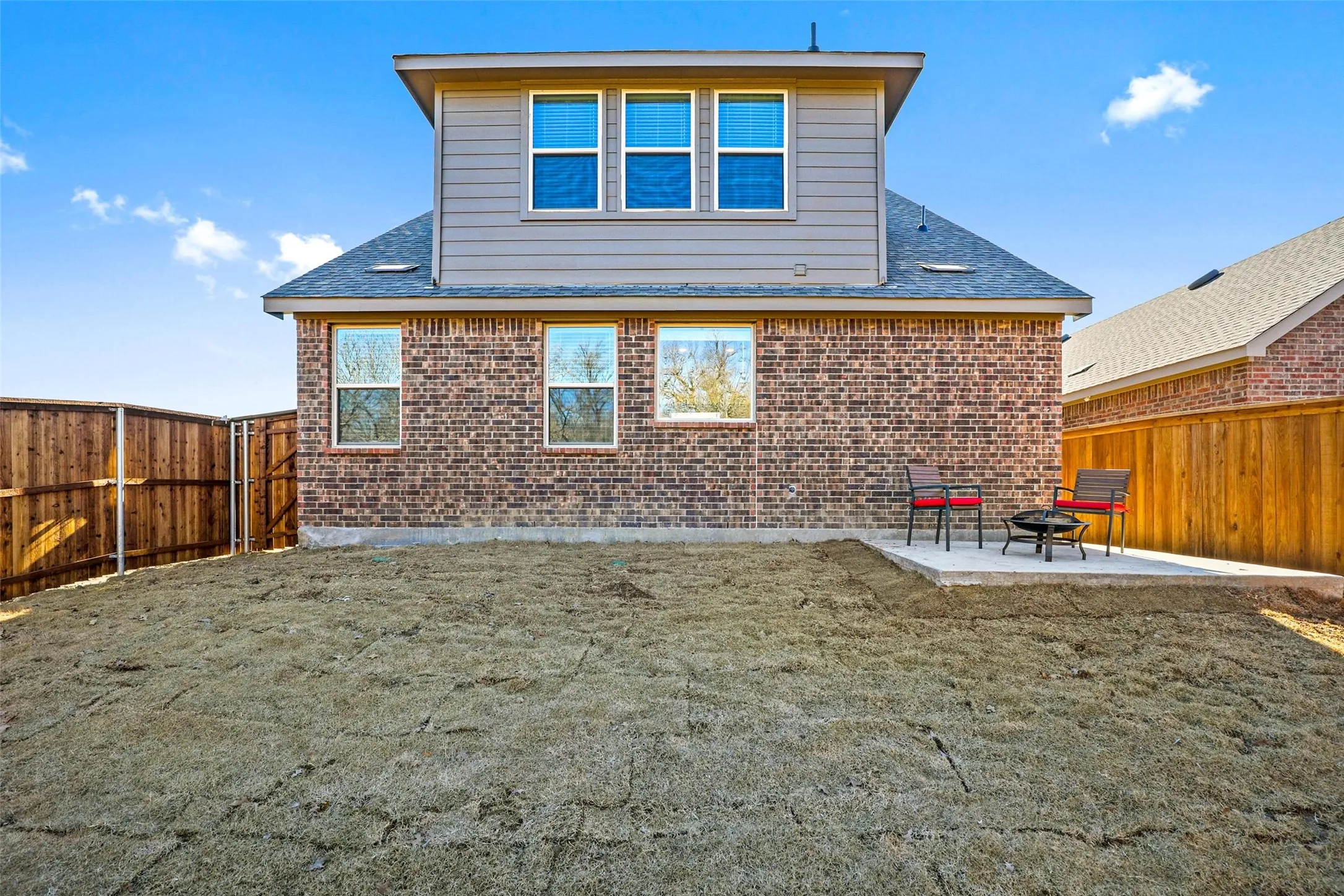 Brick exterior with vertical siding accent