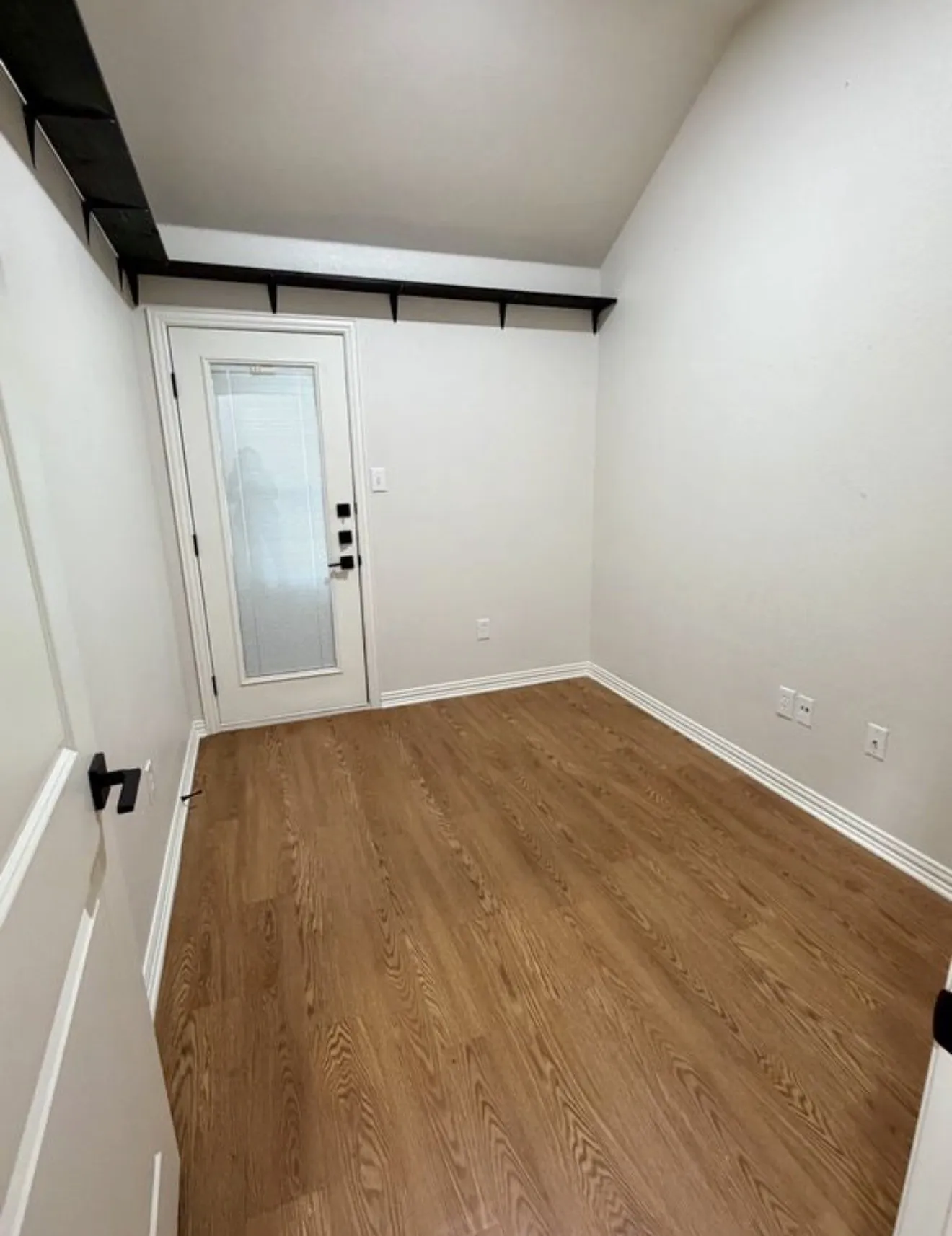Wood-finish flooring with white trim