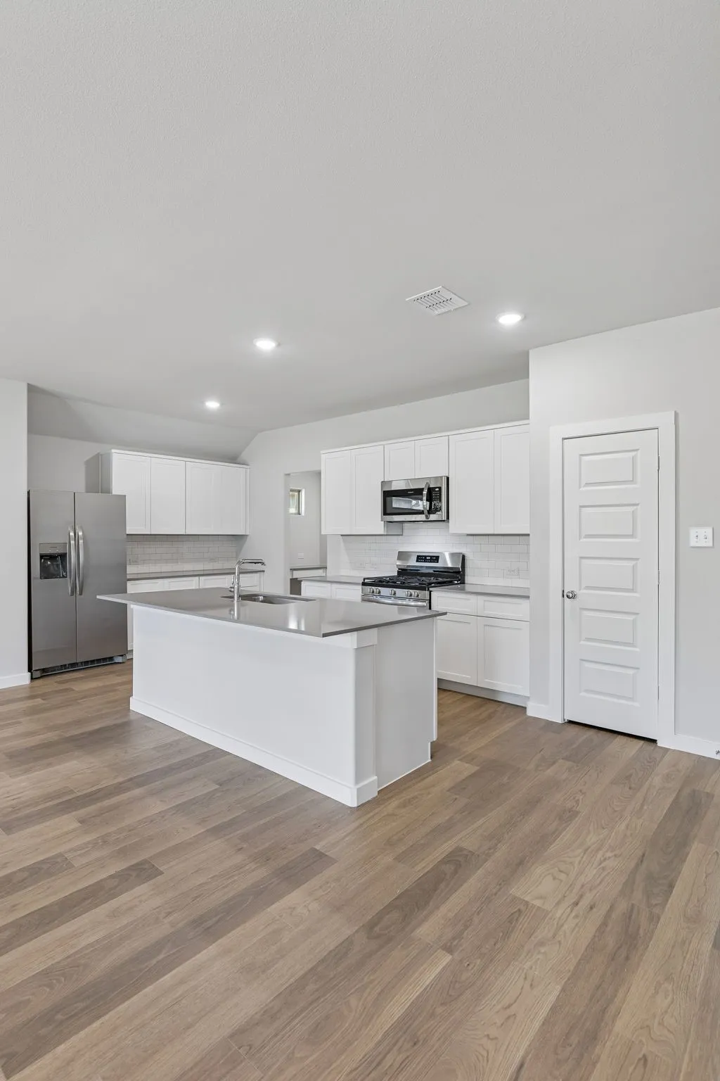 Kitchen in the Harrison home plan – REPRESENTATIVE PHOTO