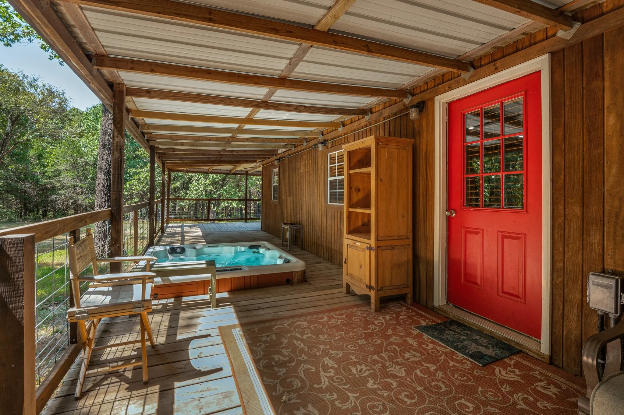 Cabin: porch with hot tub