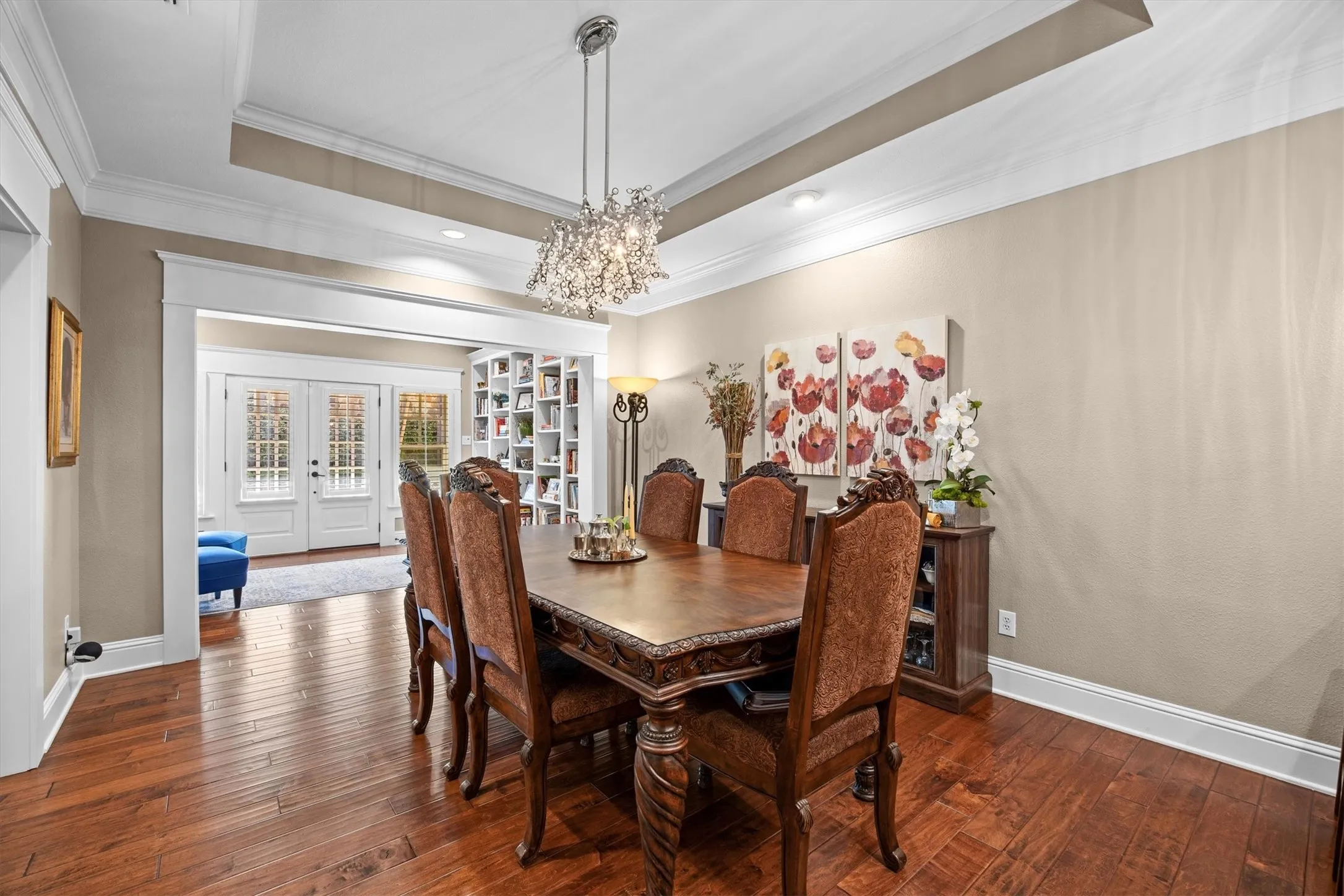 Formal dining area right off of the kitchen and living room is a focal point! Stunning light fixture and tray ceiling gives balance and highlights this perfect place for family gatherings.
