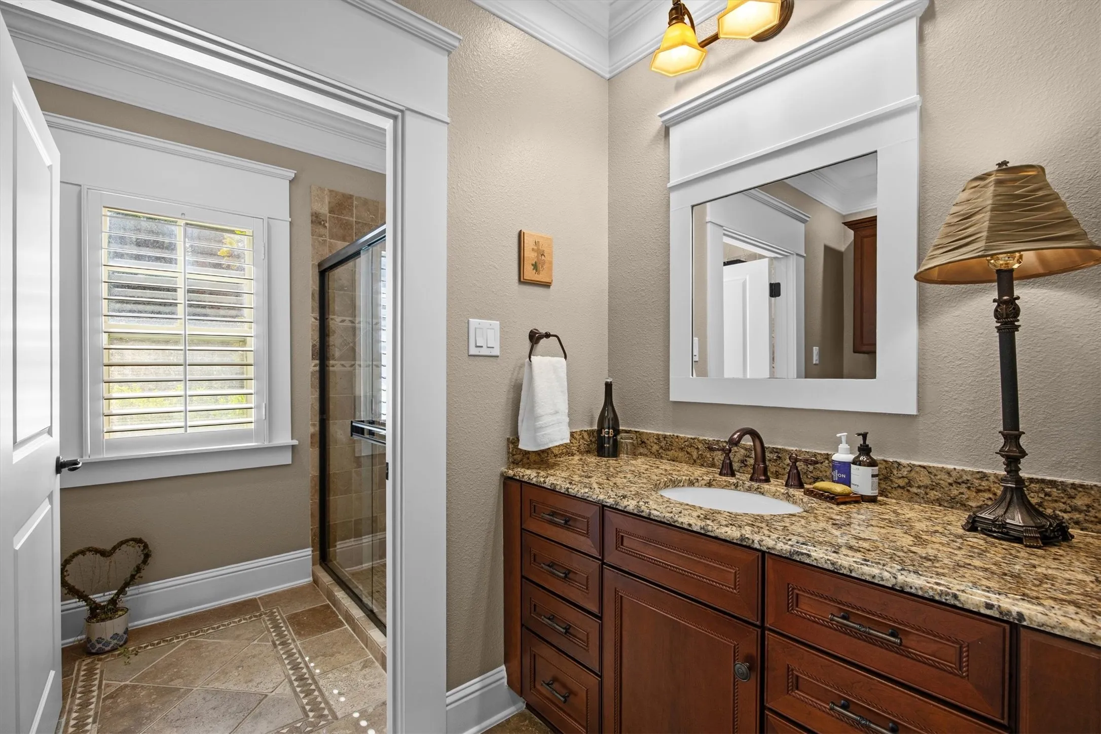 Guest bathroom with separate tub and shower along with tons of cabinet and counter space.