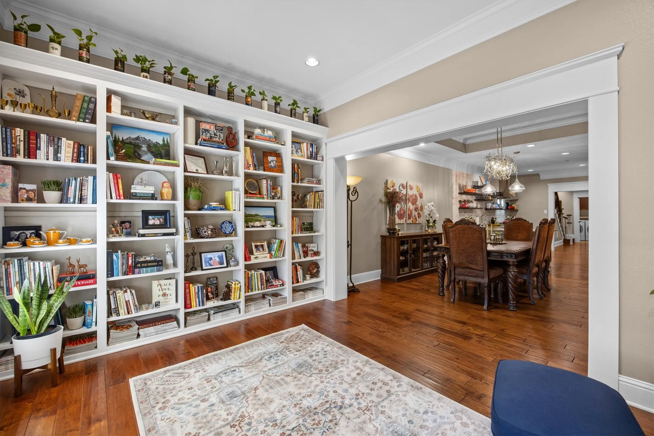Custom wall of built in book shelves gives this room a very special touch.