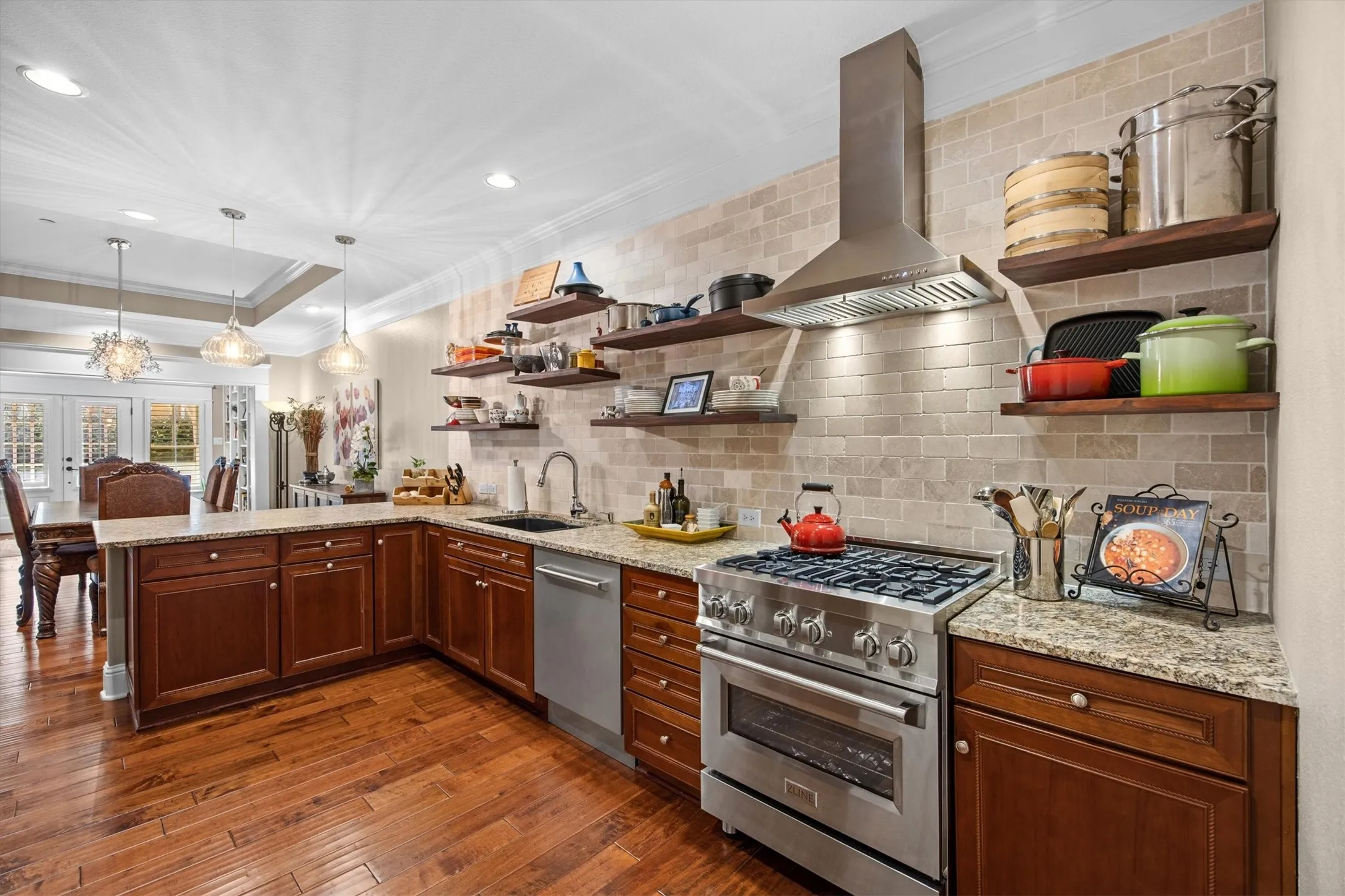 Heavy-duty, stud-anchored floating shelving designed for high-capacity storage along with professional grade gas range, & high-CFM range hood!