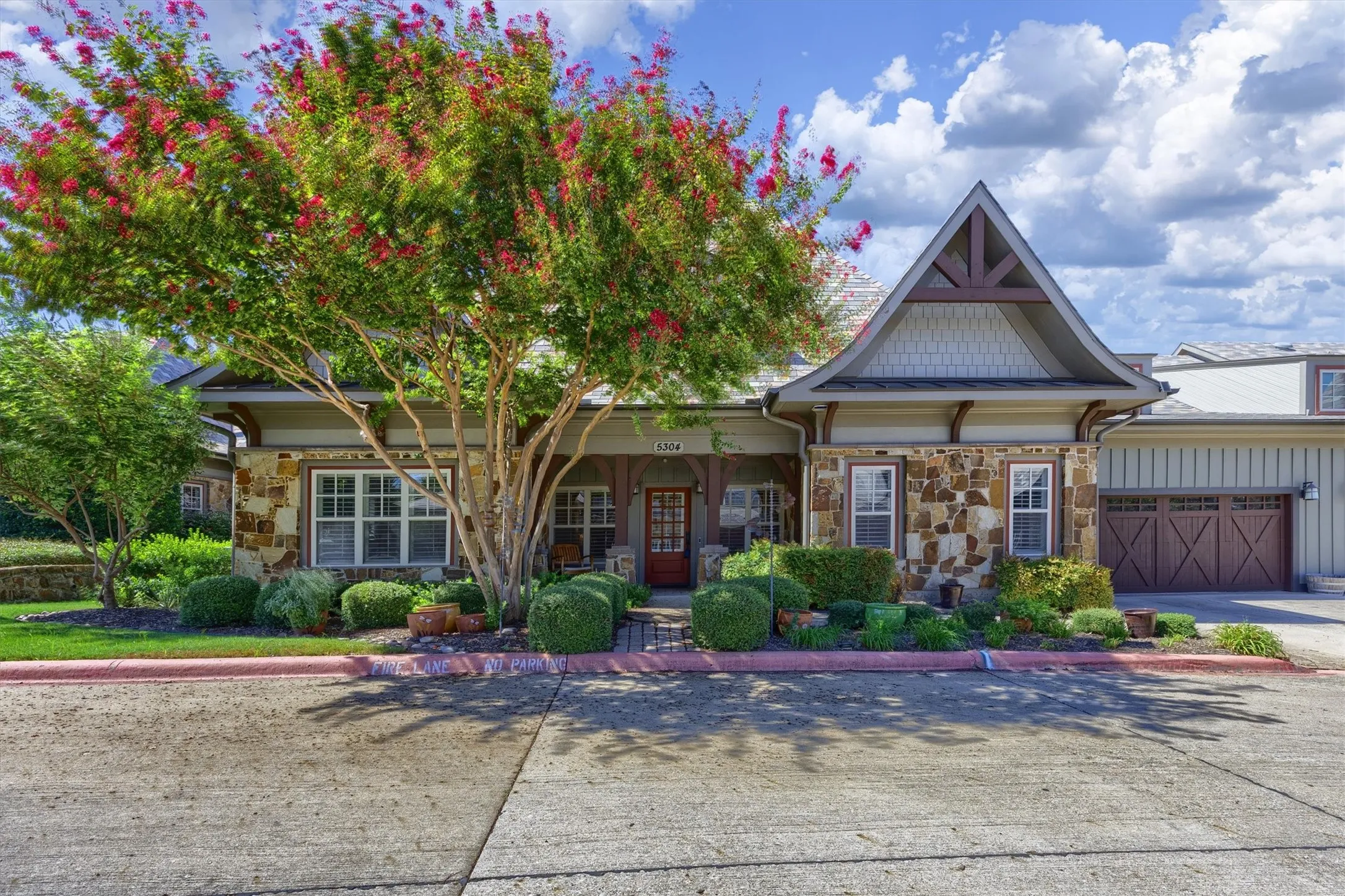 Beautiful texture created with Stone elevation and lush landscaping in this sought after community.
