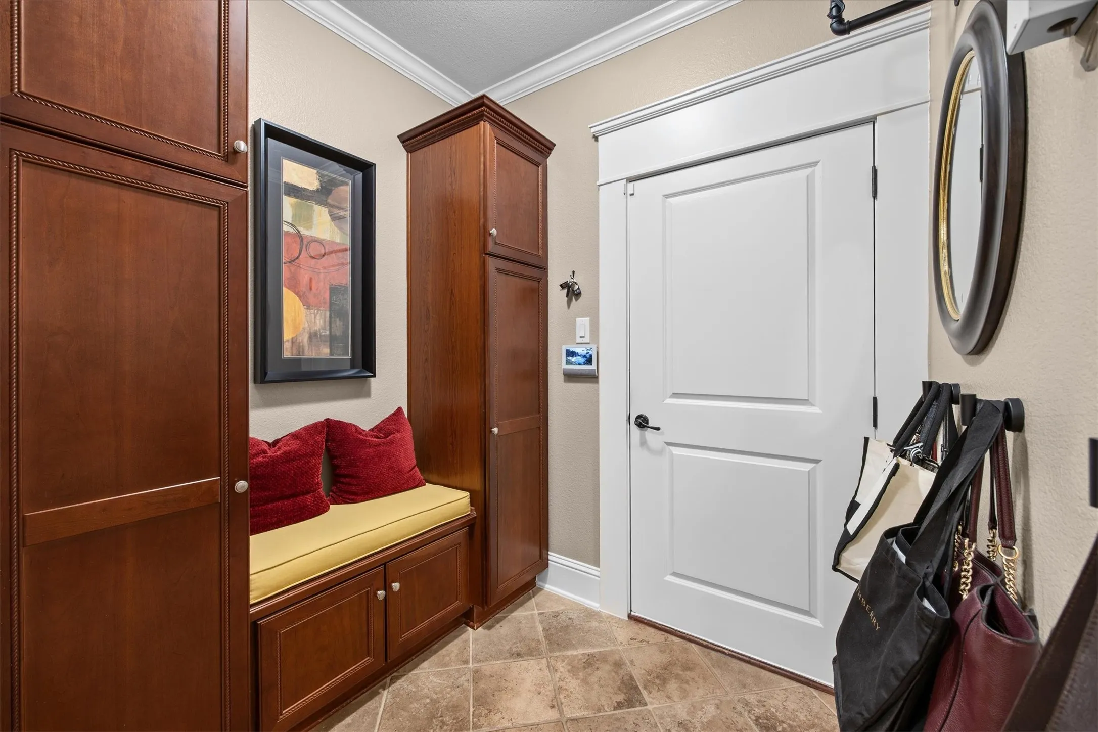 Laundry room expands into perfect mud room complete with built in bench and plenty of room for all your larger items that you want neatly tucked away.