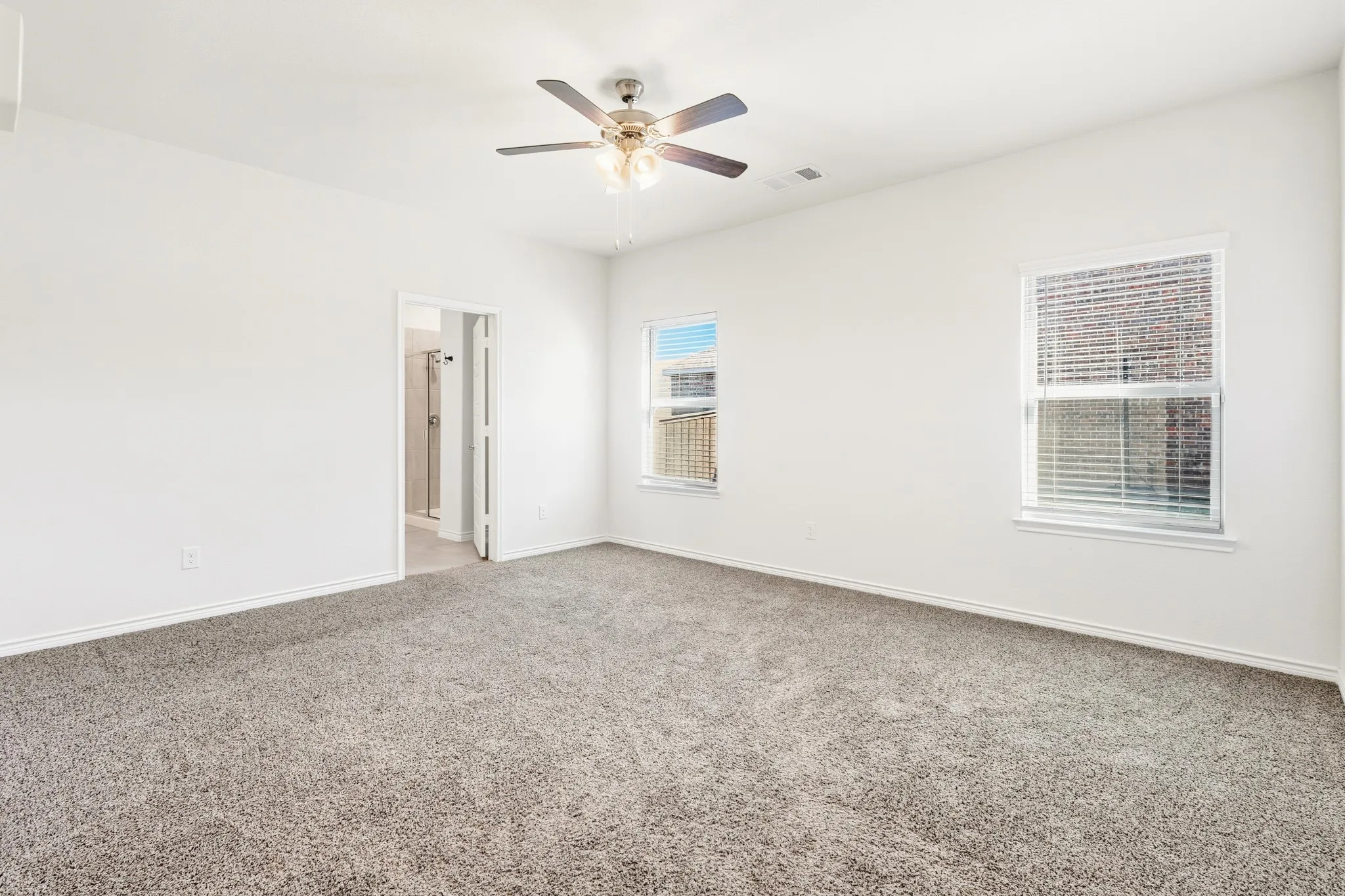 White painted walls and gray carpeting