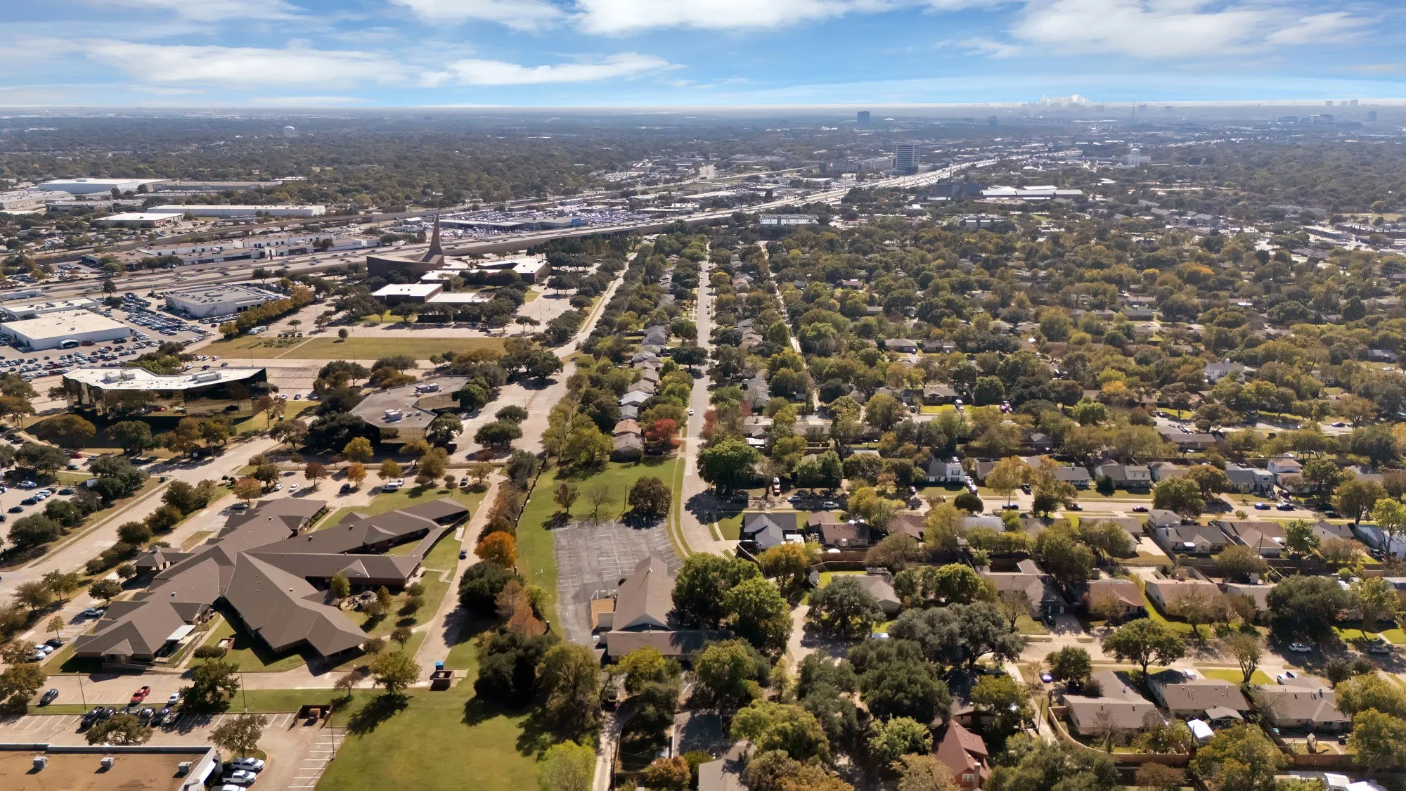 Aerial overview of property's location with nearby suburban area