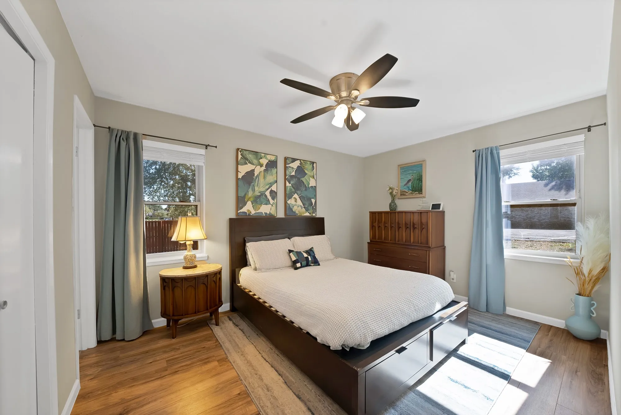 Bedroom with wood finished floors and ceiling fan