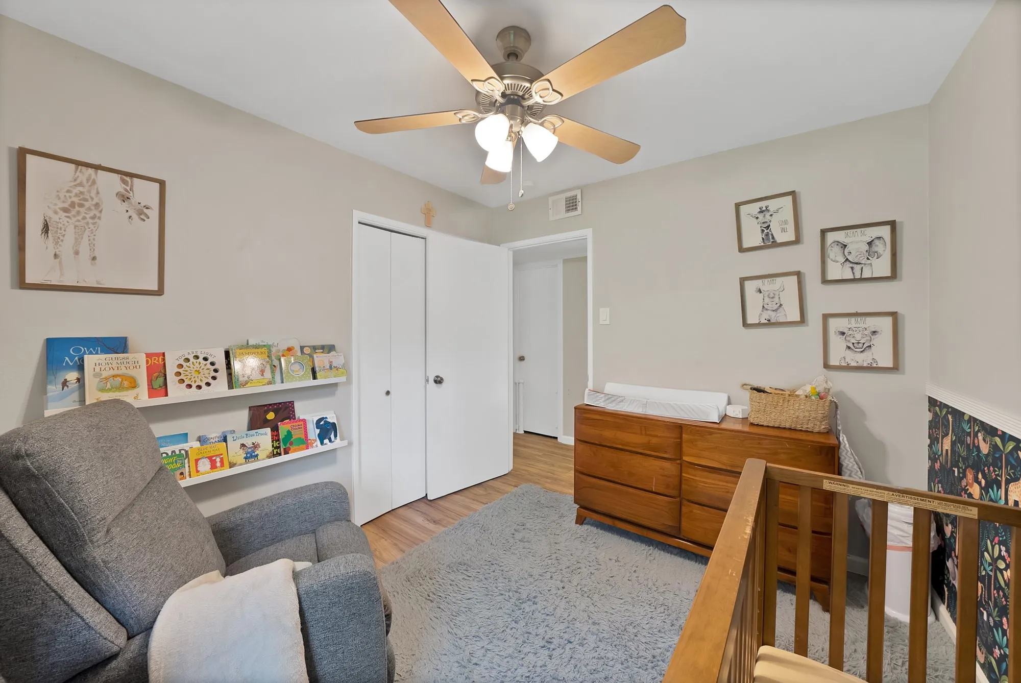 Bedroom featuring a closet, wood finished floors, and a ceiling fan