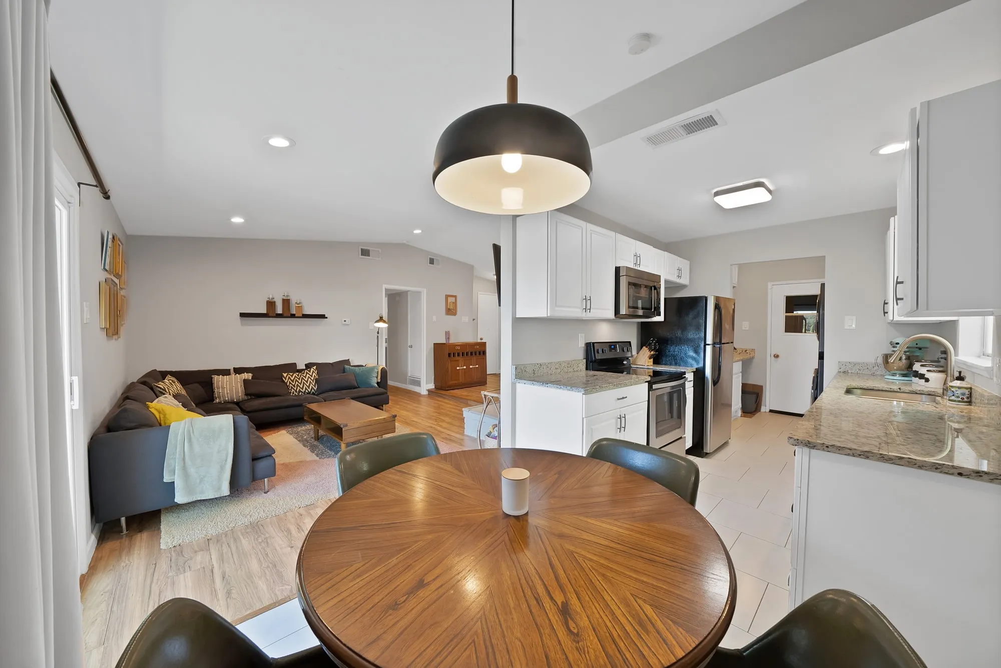 Dining area with recessed lighting and light wood-style floors