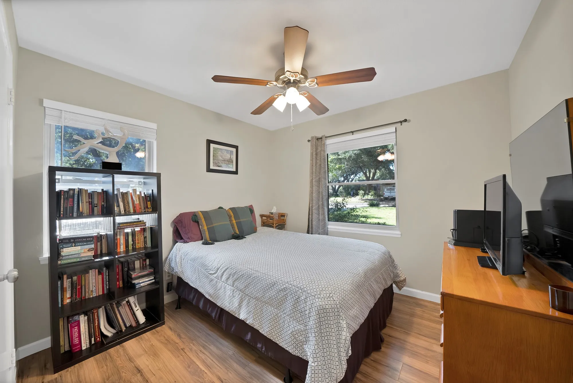 Bedroom featuring wood finished floors and ceiling fan