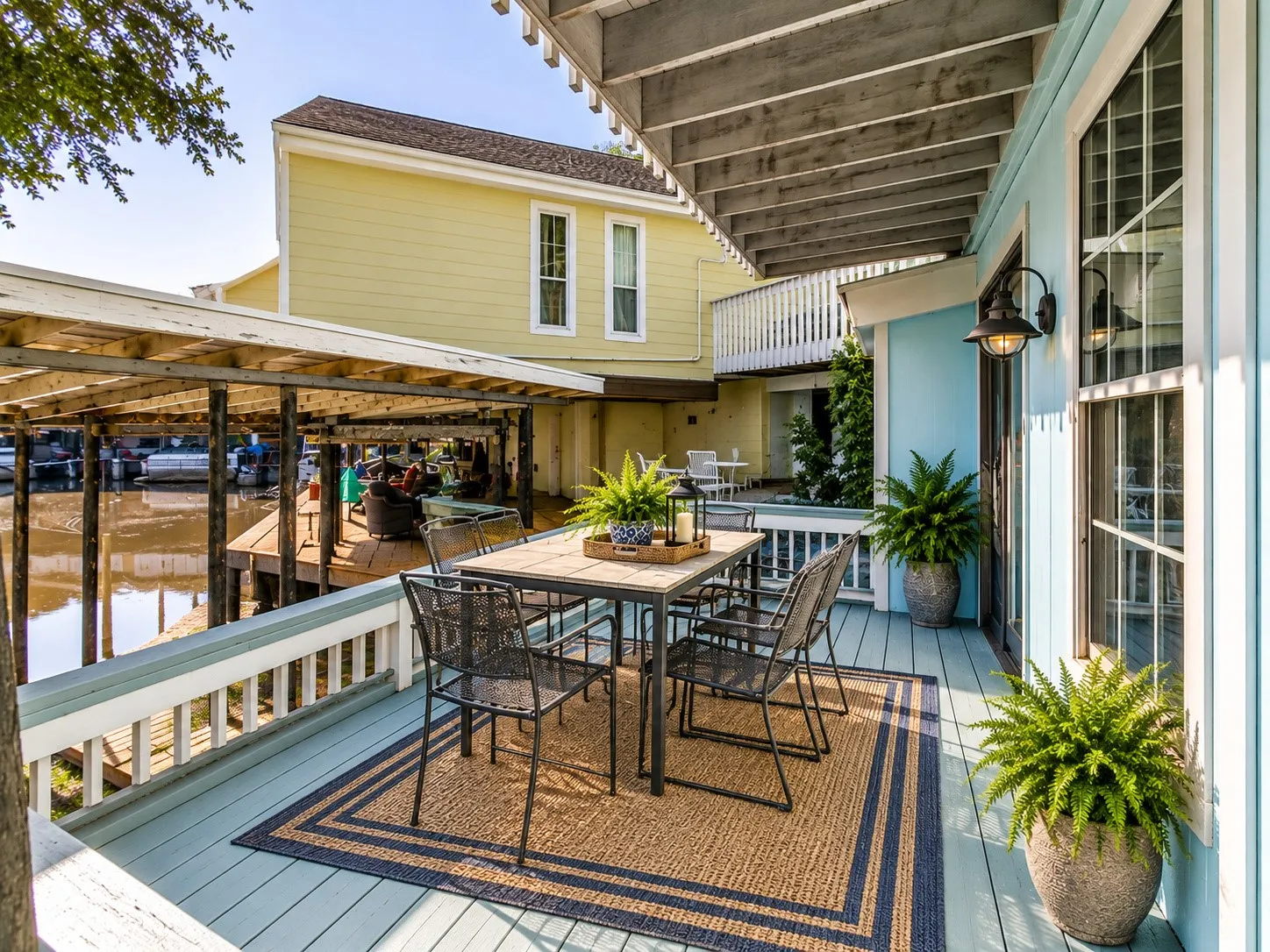 Covered outdoor deck with painted wood flooring - virtually staged