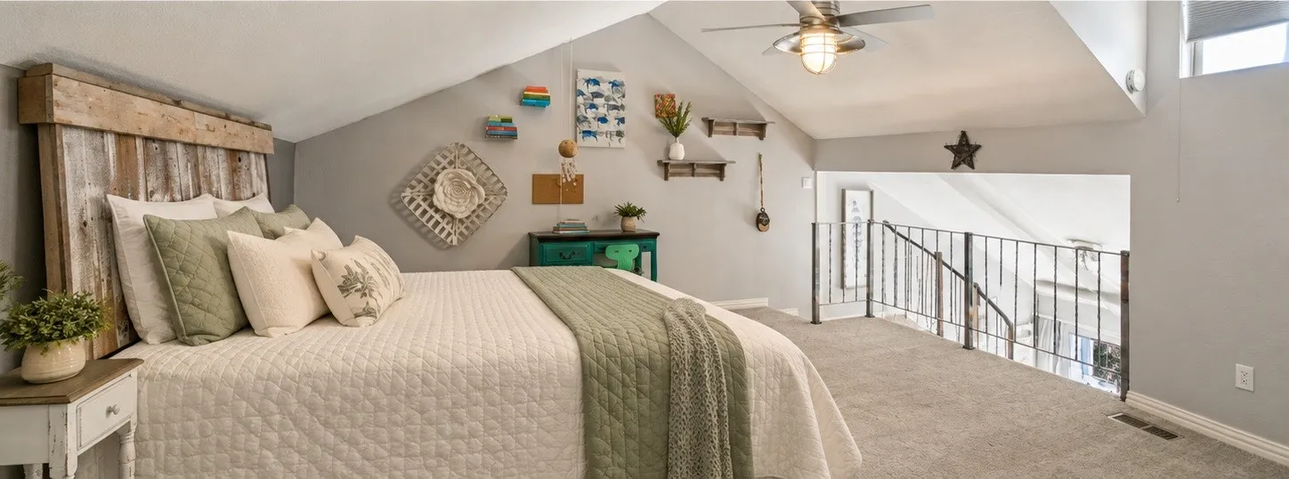 Vaulted ceiling with recessed lighting, ceiling fan, carpet flooring, open railing, and a window