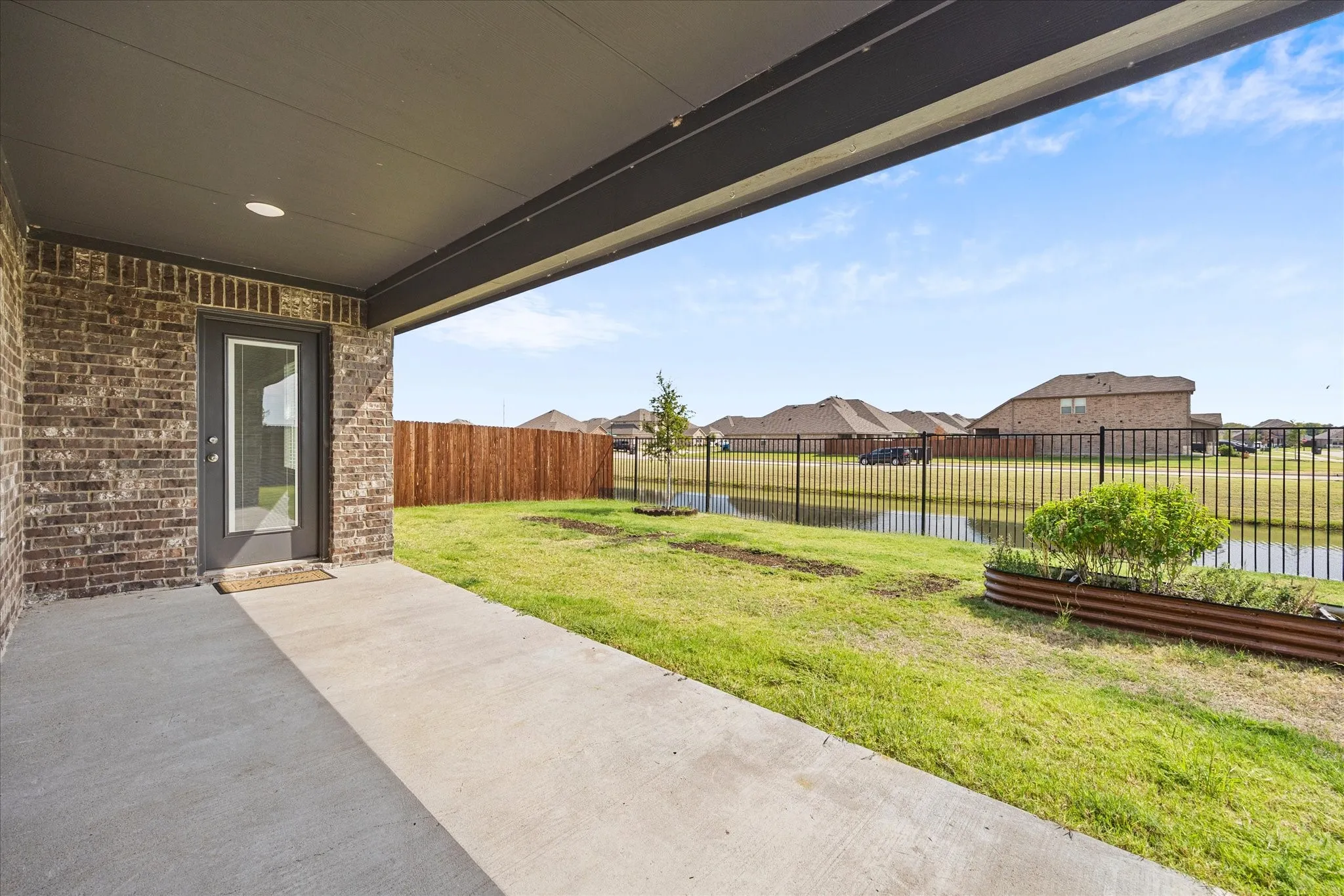 Extended patio overlooks private backyard and neighborhood canal!