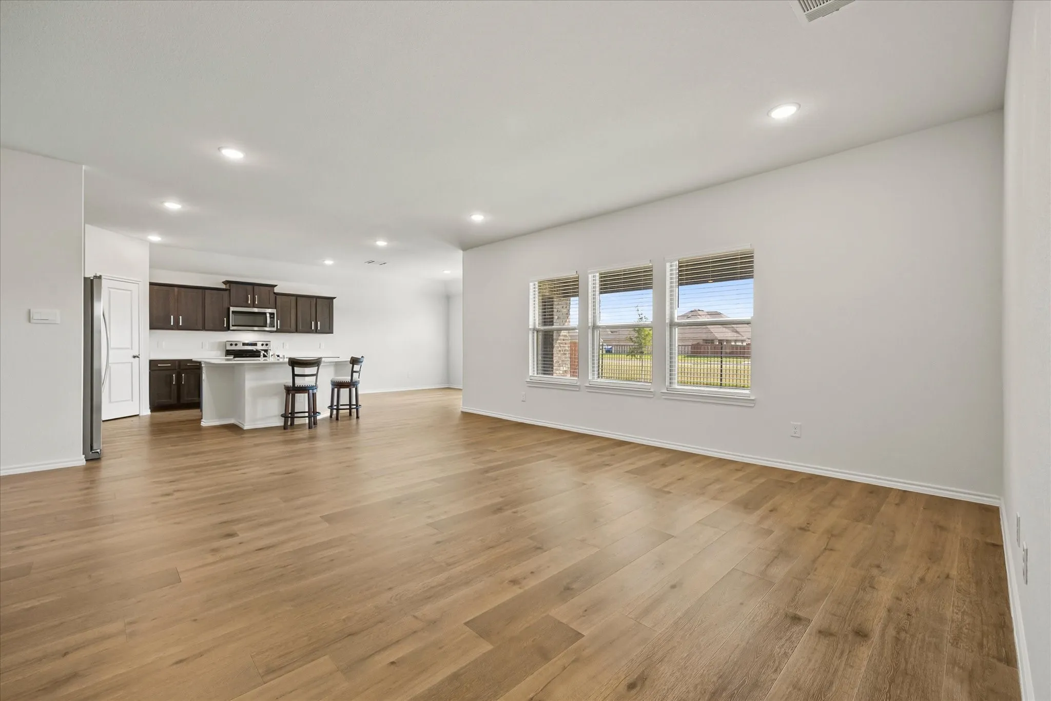 Banks of windows provide an abundance of natural lighting in family room.