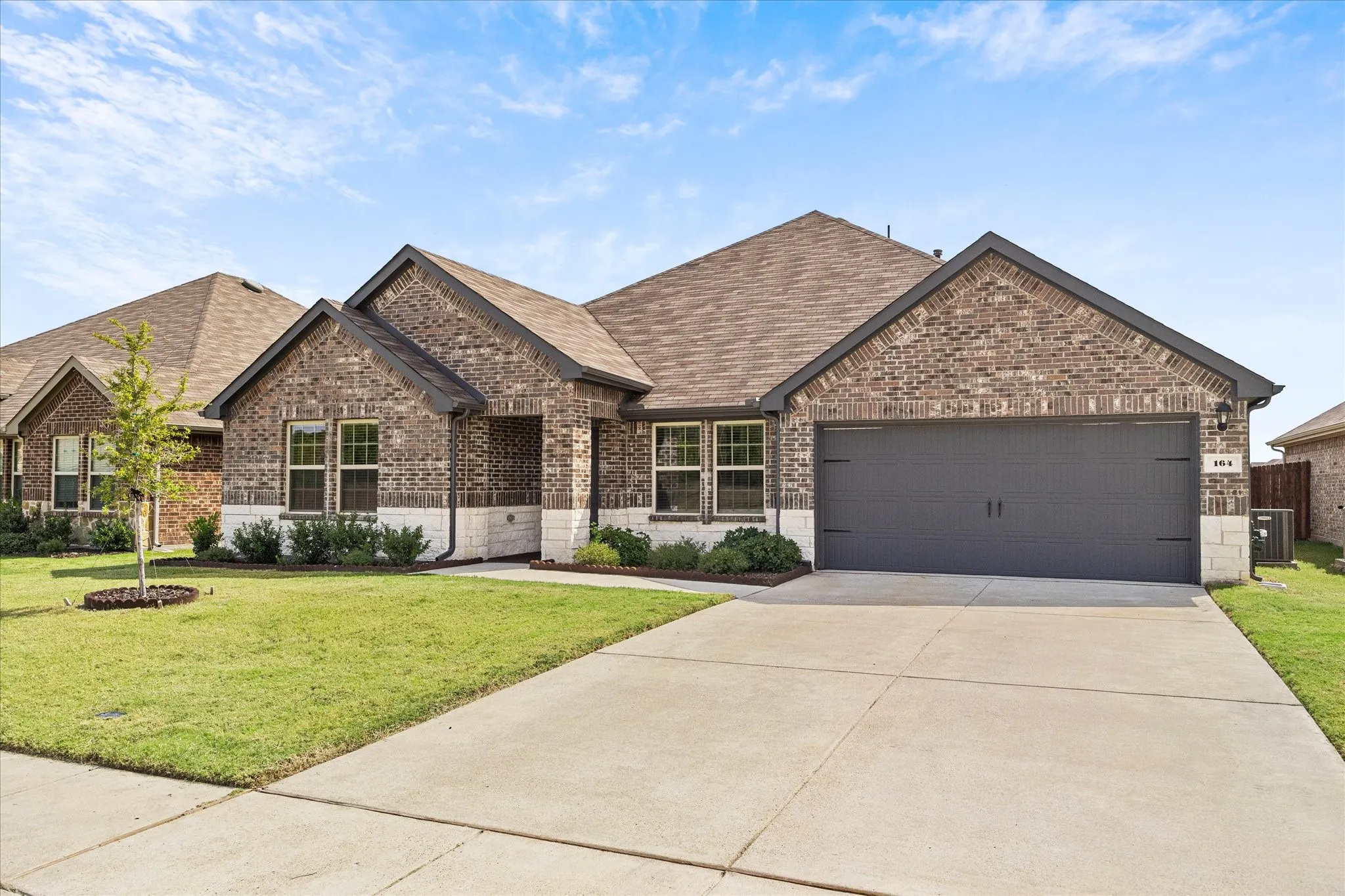 2 car garage and extended driveway provides ample parking for family and friends