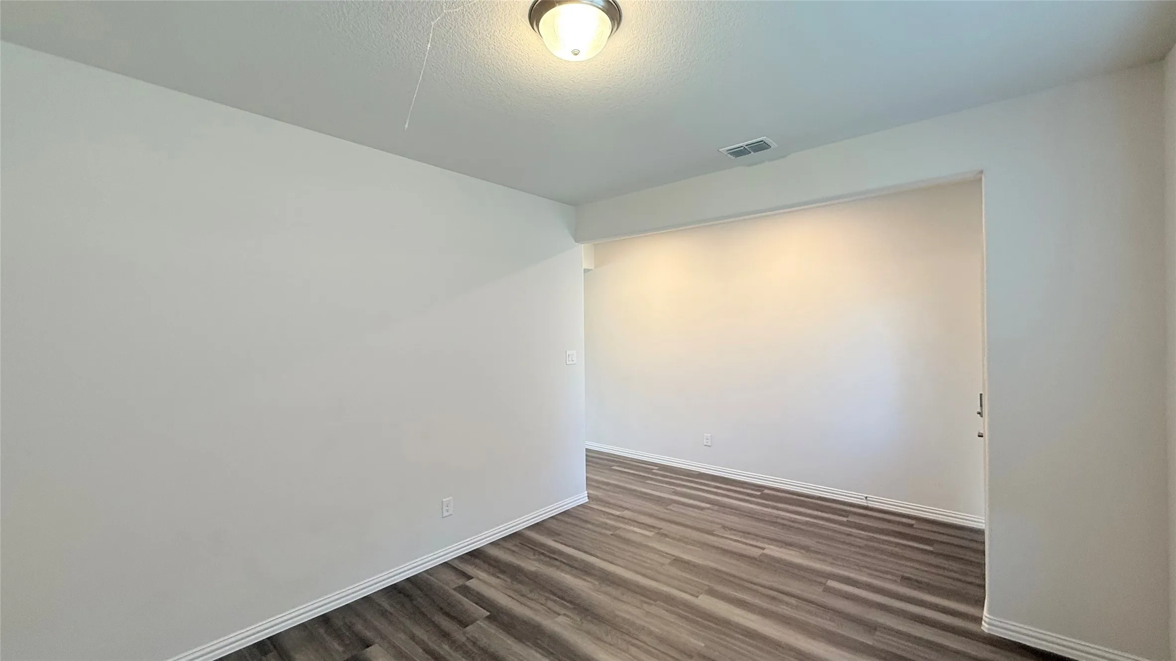 Wood-finish flooring throughout
