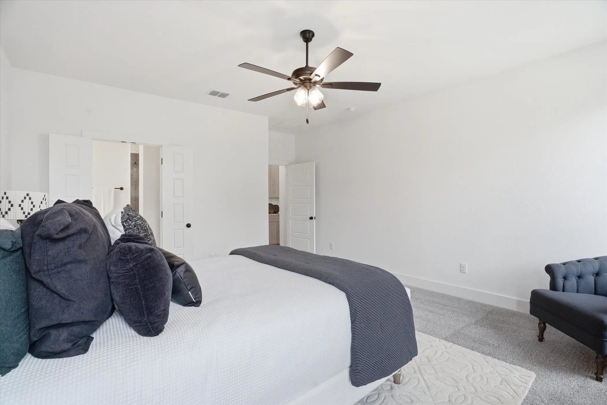 Recessed lighting, ceiling fan with light fixture, carpet flooring, and white interior doors