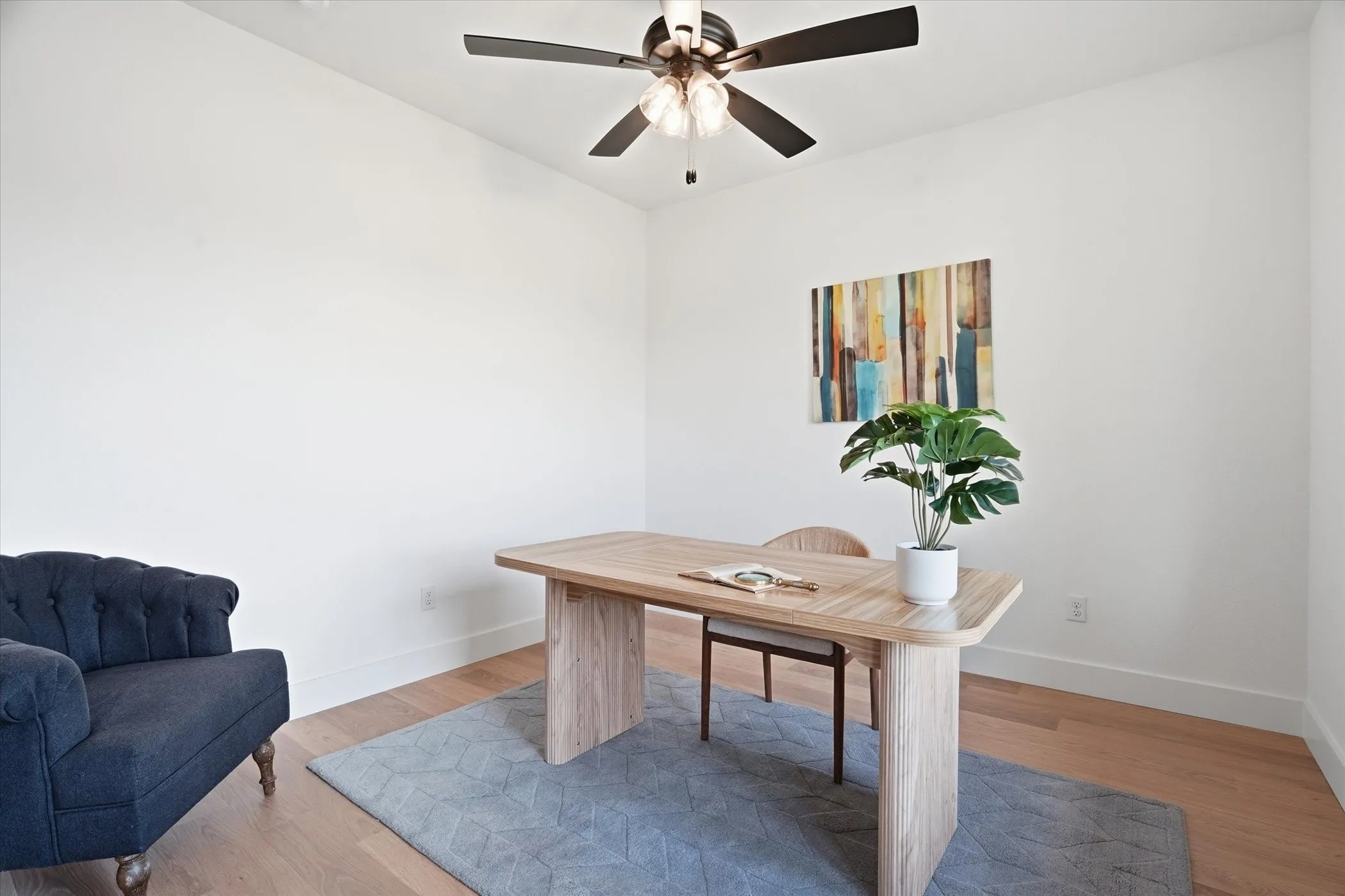 Recessed lighting, ceiling fan with light fixture, light wood-finish flooring, and white walls