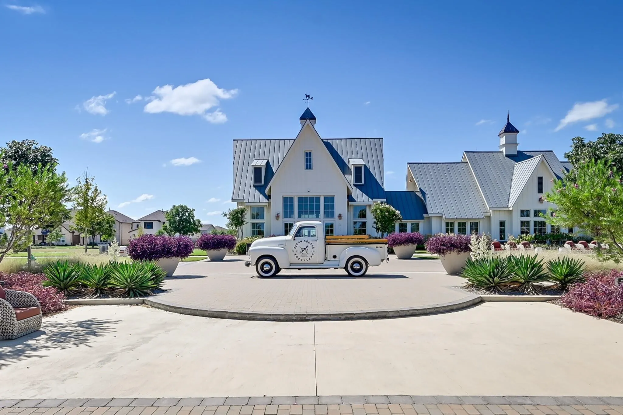 Spacious circular driveway with paver accents
