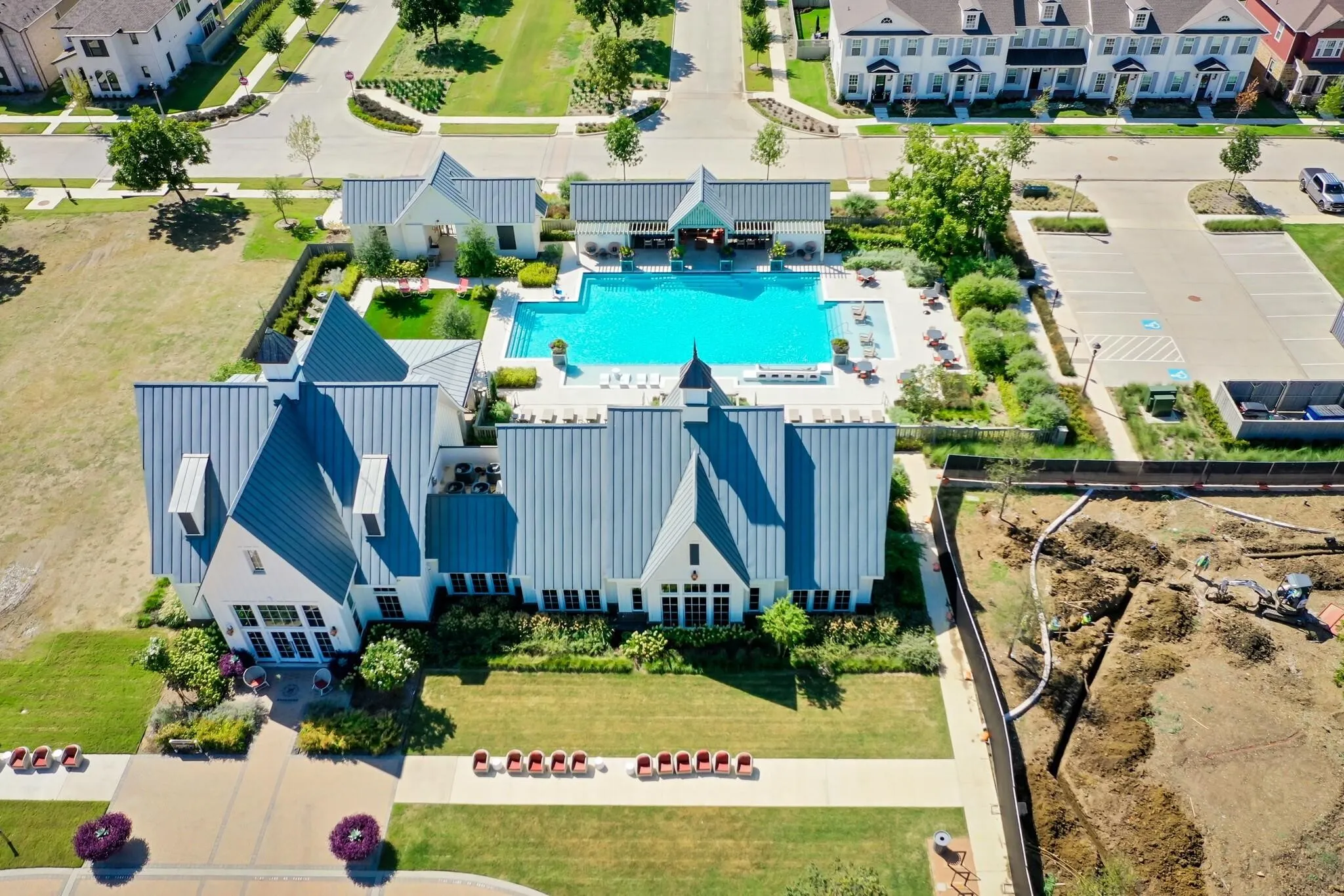 Resort-style pool with integrated lounging areas and surrounding hardscaping
