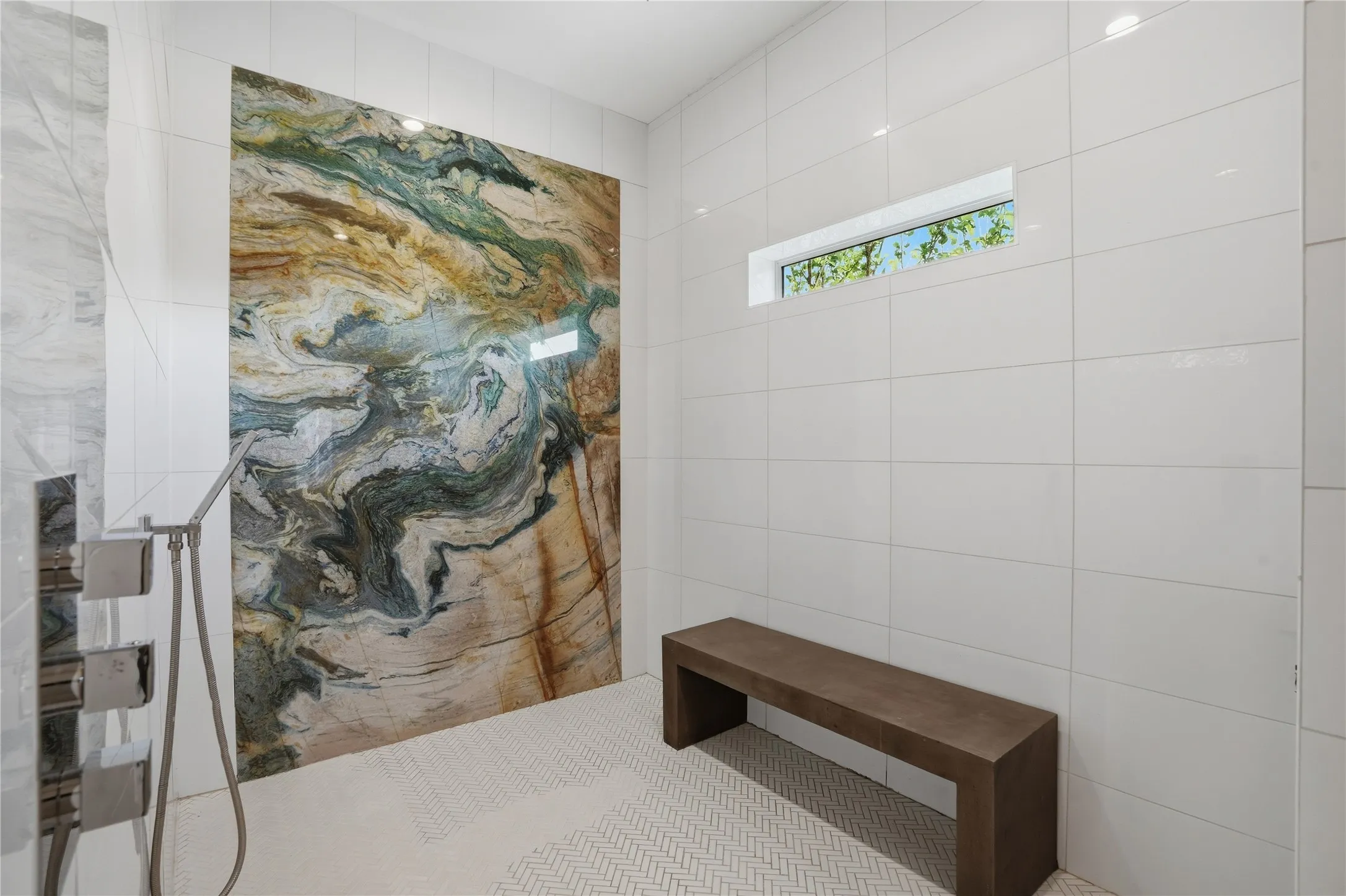Stunning marble slab in the oversized primary shower