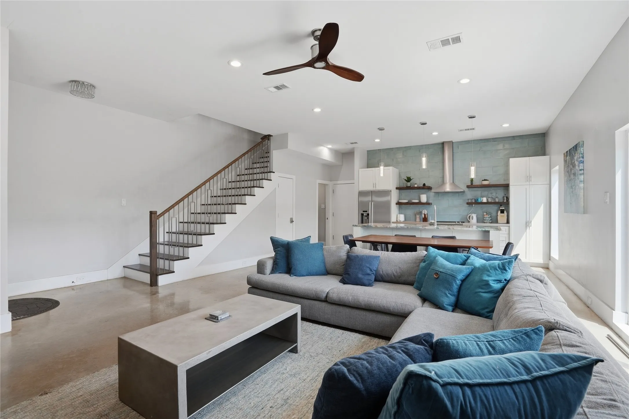 Living room leading to upstairs