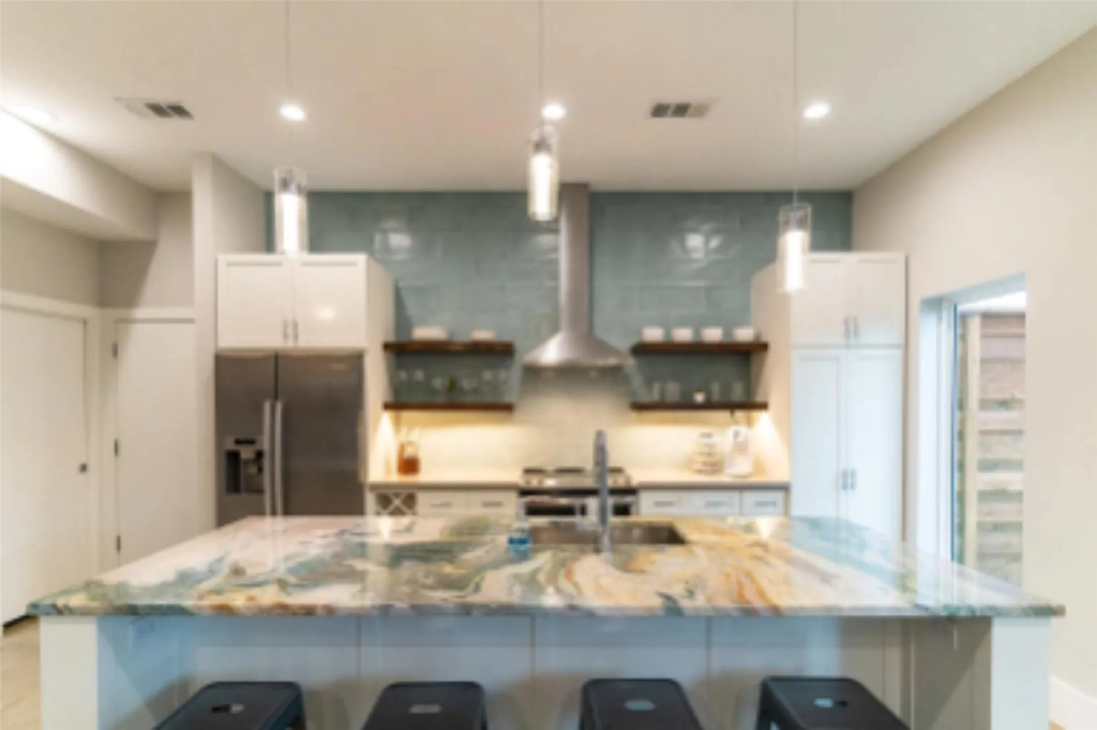 Incredibly unique marble slab on the kitchen island is a complete showstopper