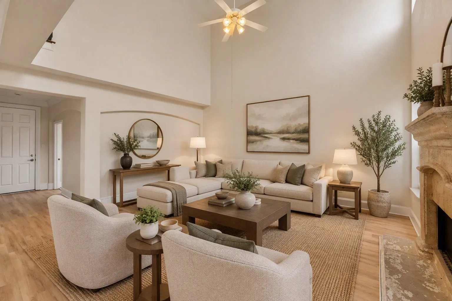 Vaulted ceilings with a ceiling fan, a stone-finish fireplace, and wood-finish flooring