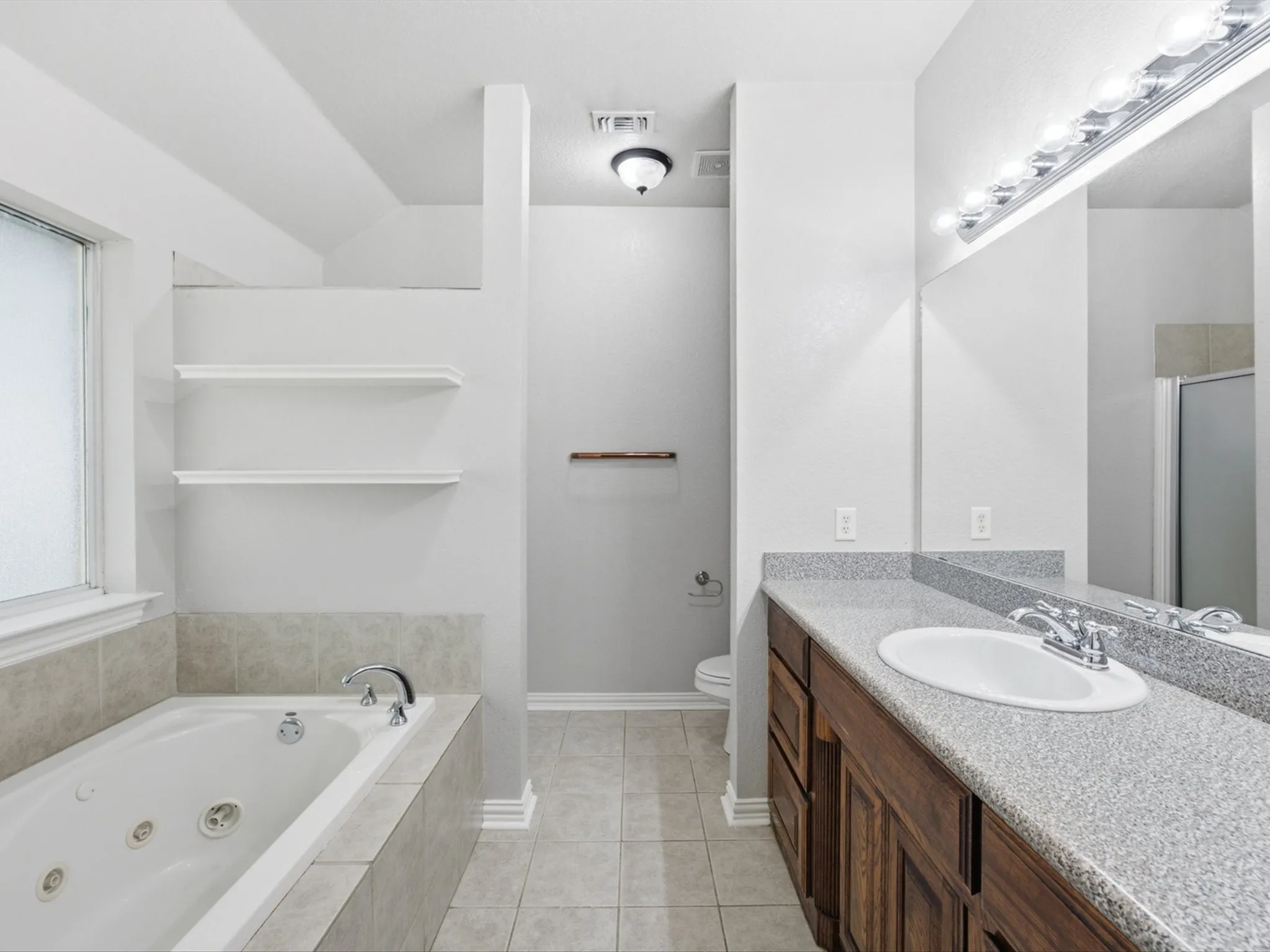 The primary bathroom with a walk in shower