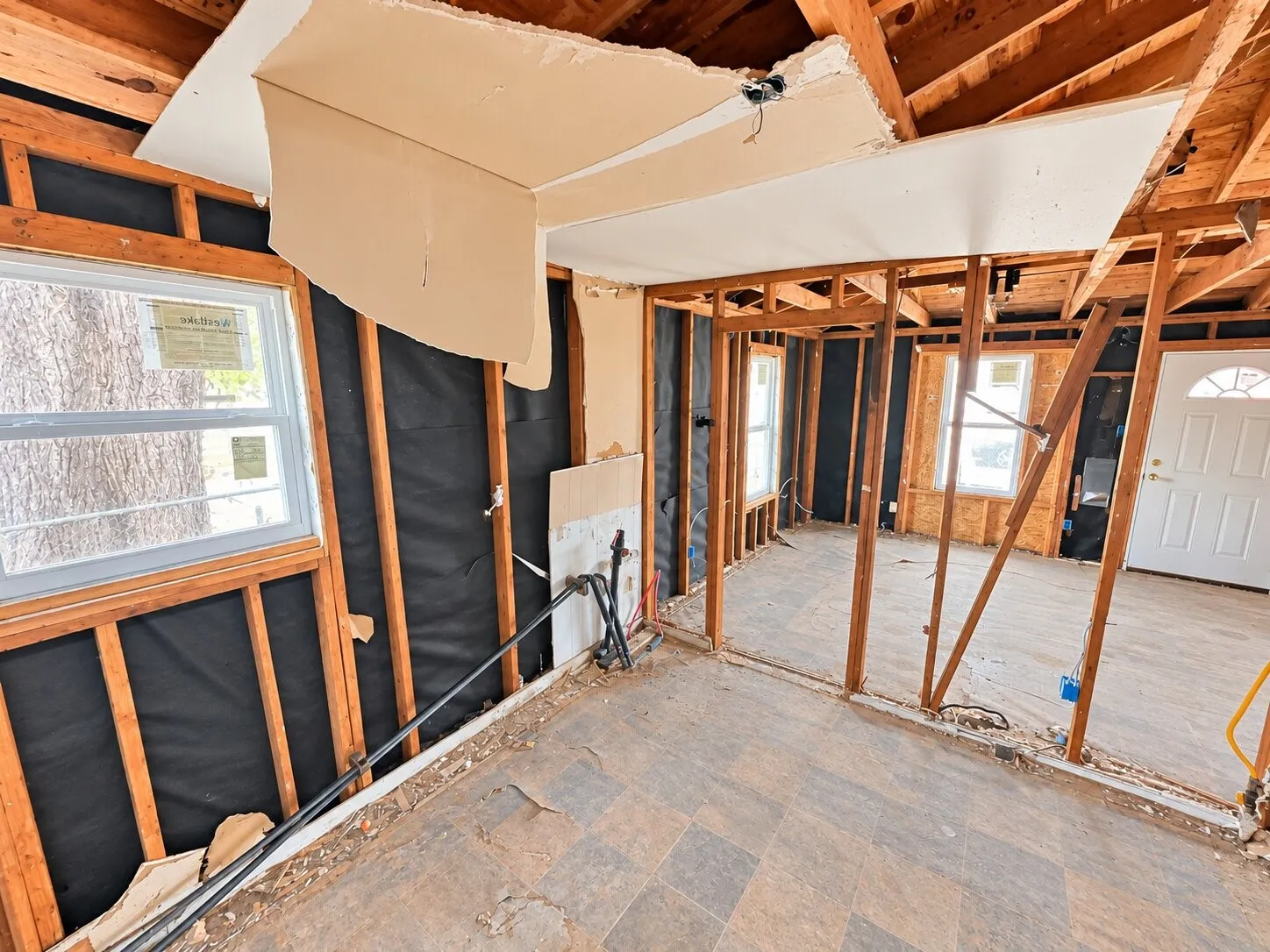 Exposed wood framing and open ceiling joists