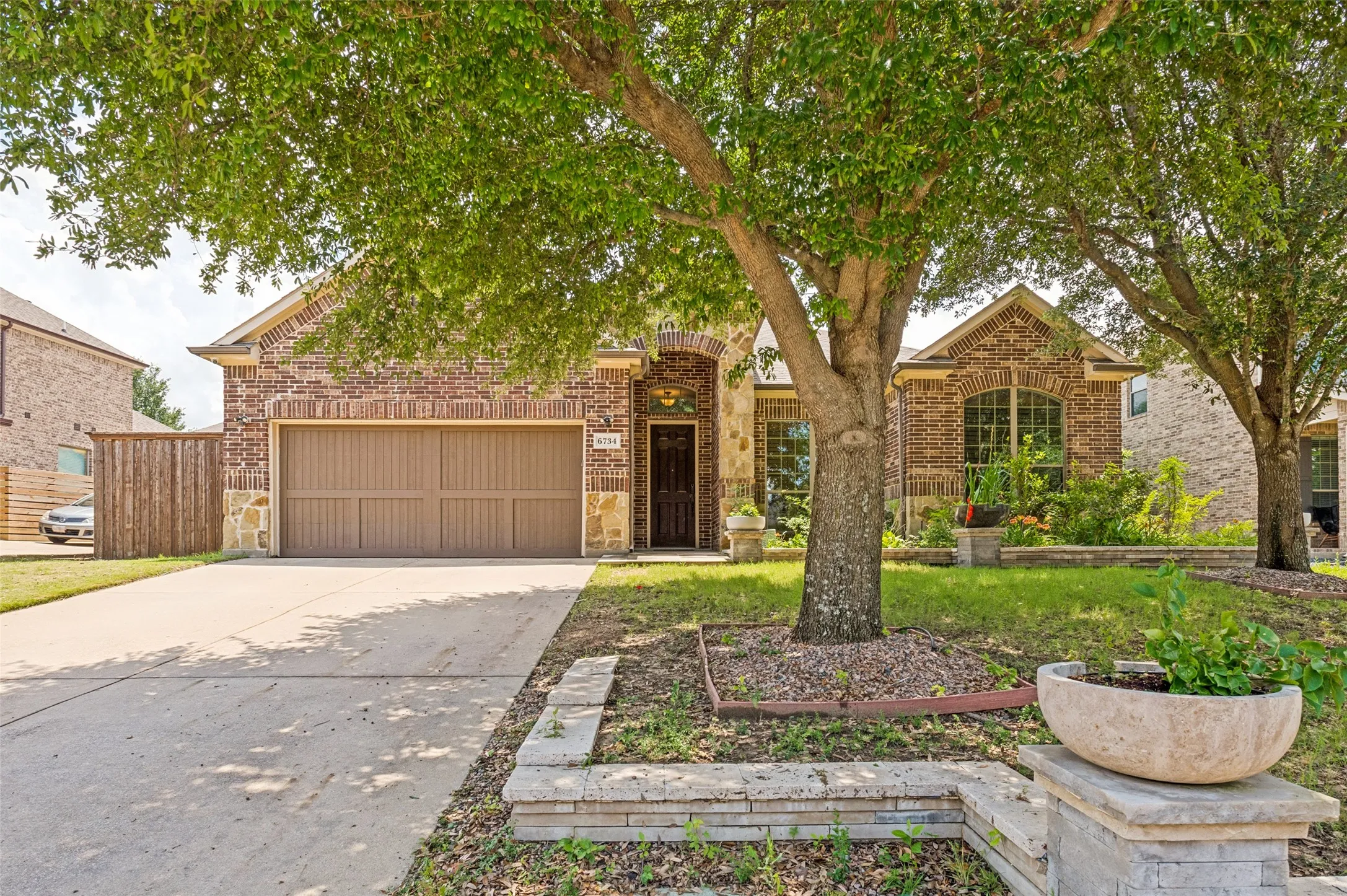 Brick and stone exterior with arched entry